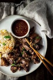 Savory Korean bulgogi with fried rice and dipping sauce