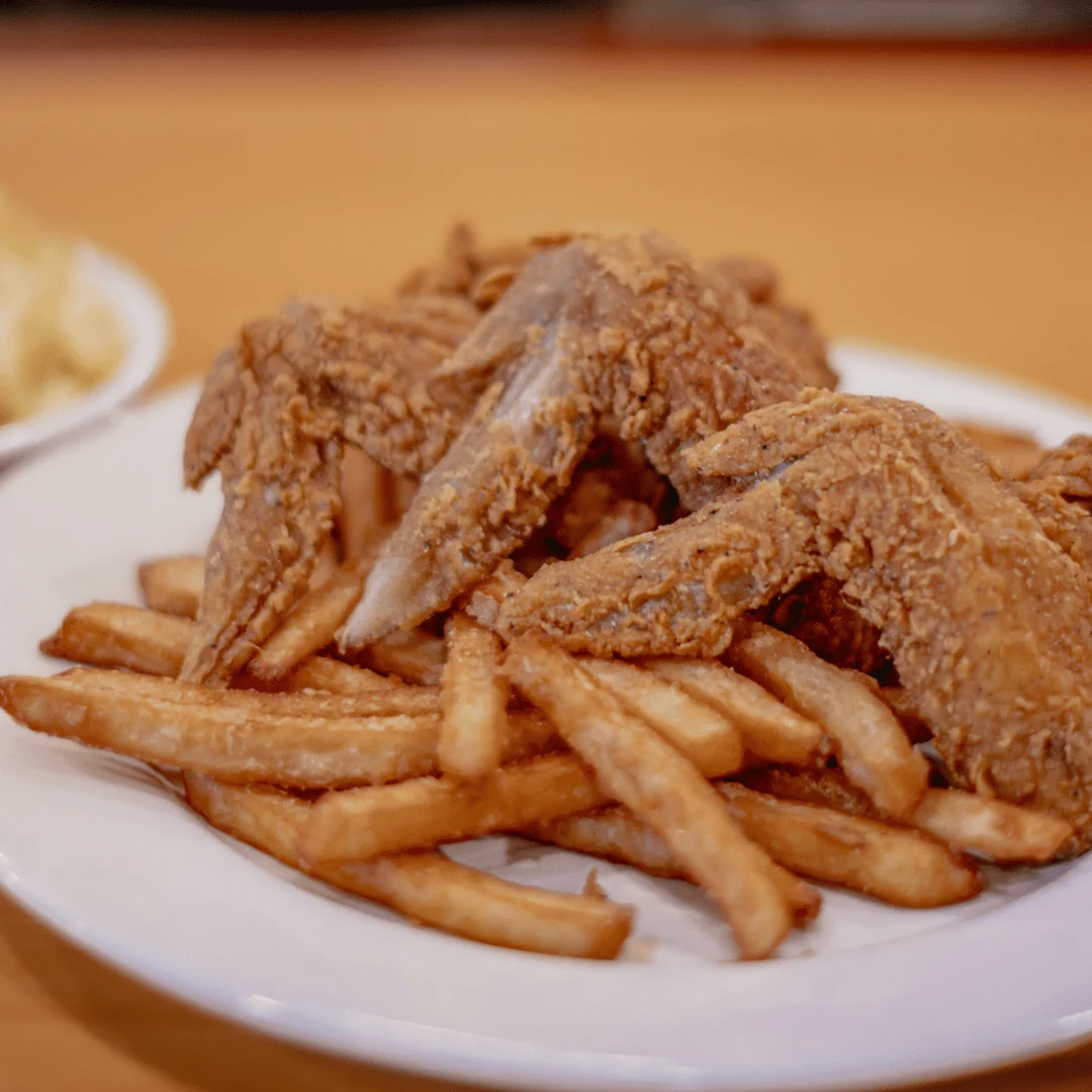 Fried chicken wings and fries