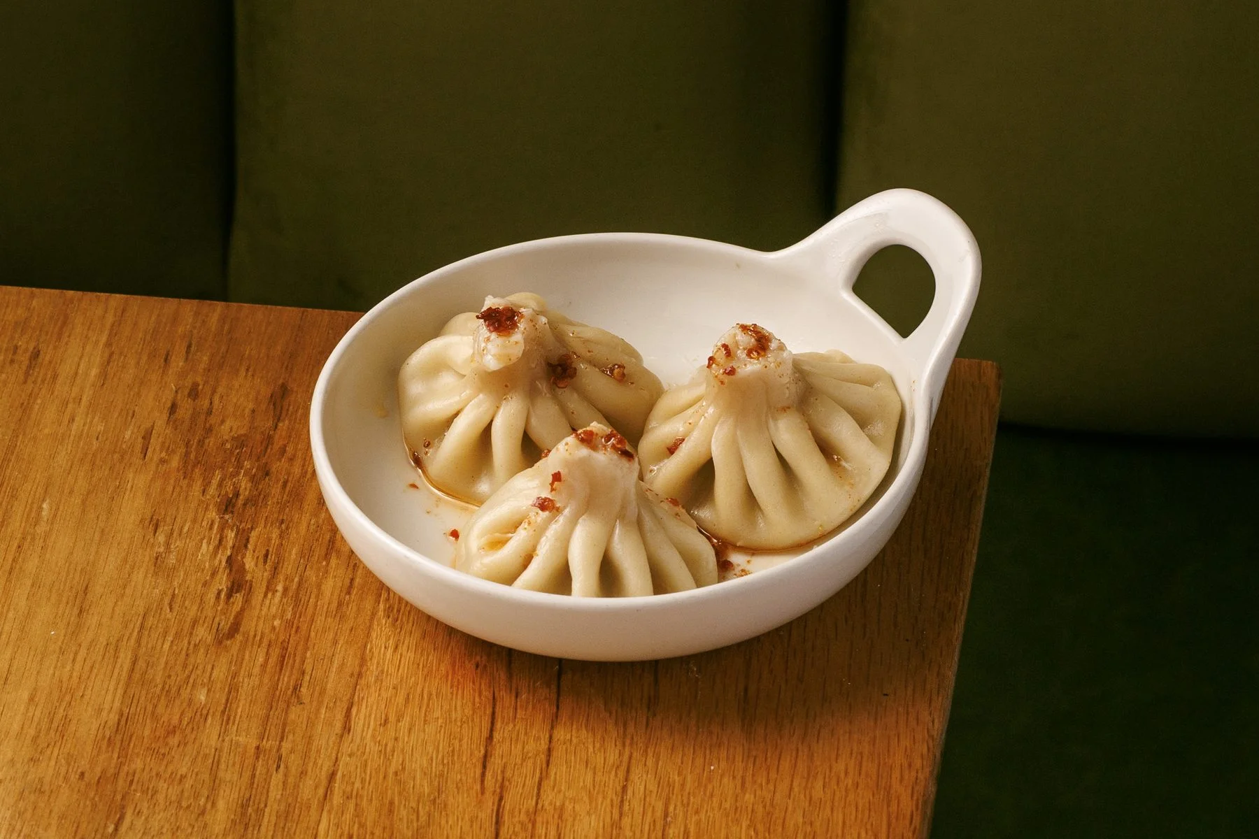Turkey khinkali in a white serving dish