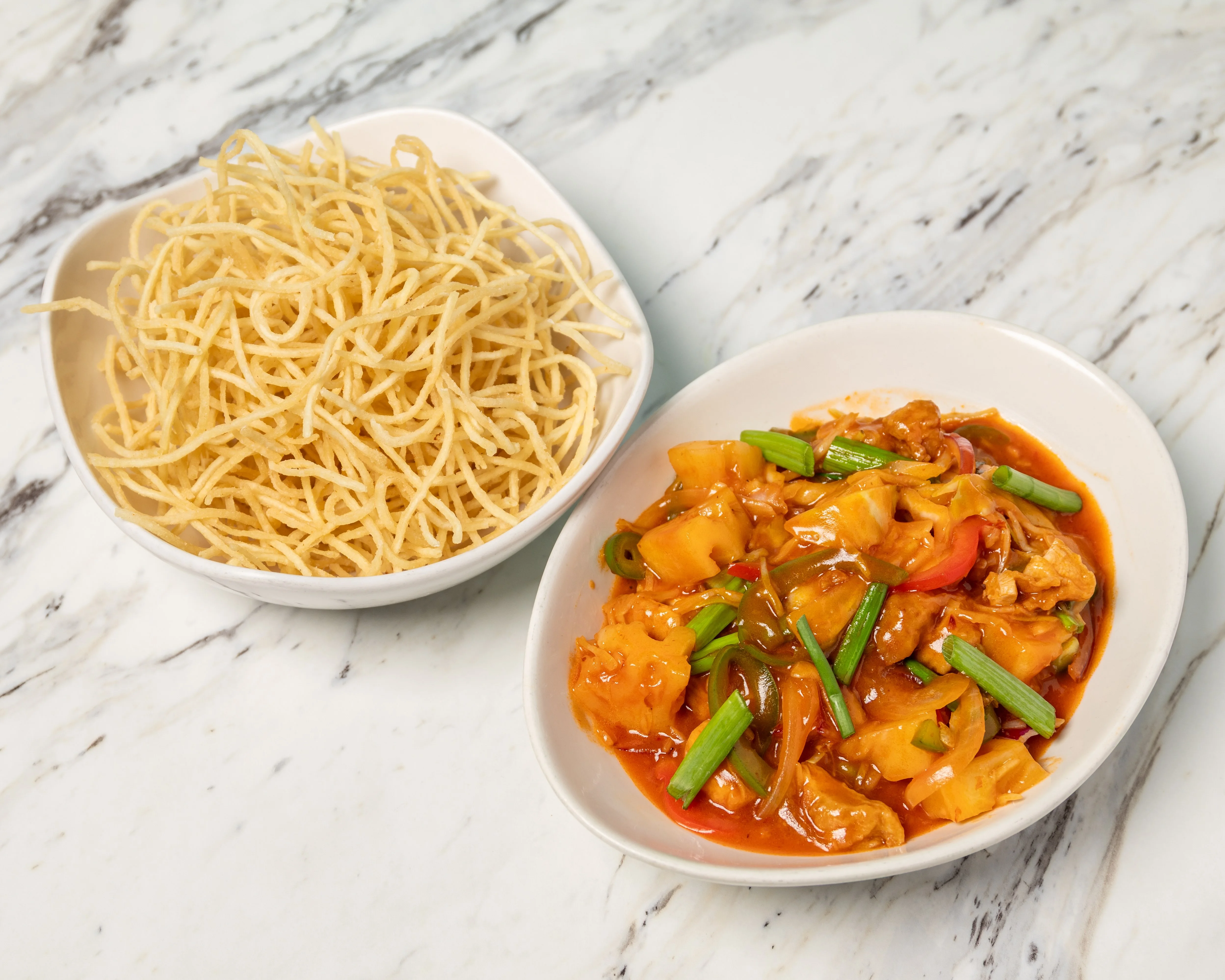 Sweet and sour chicken with crispy noodles