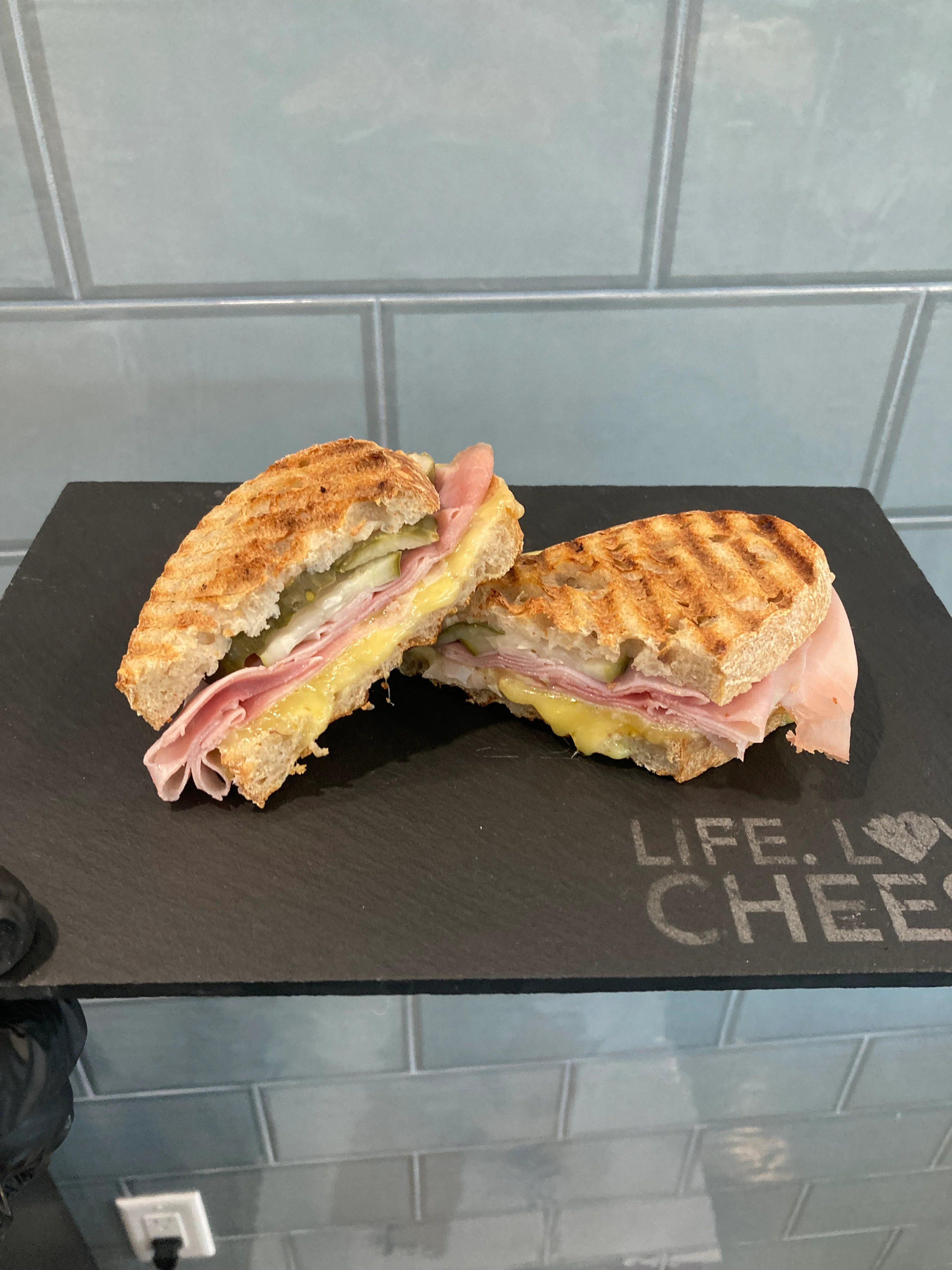 Grilled ham and cheese sandwich on whole grain bread