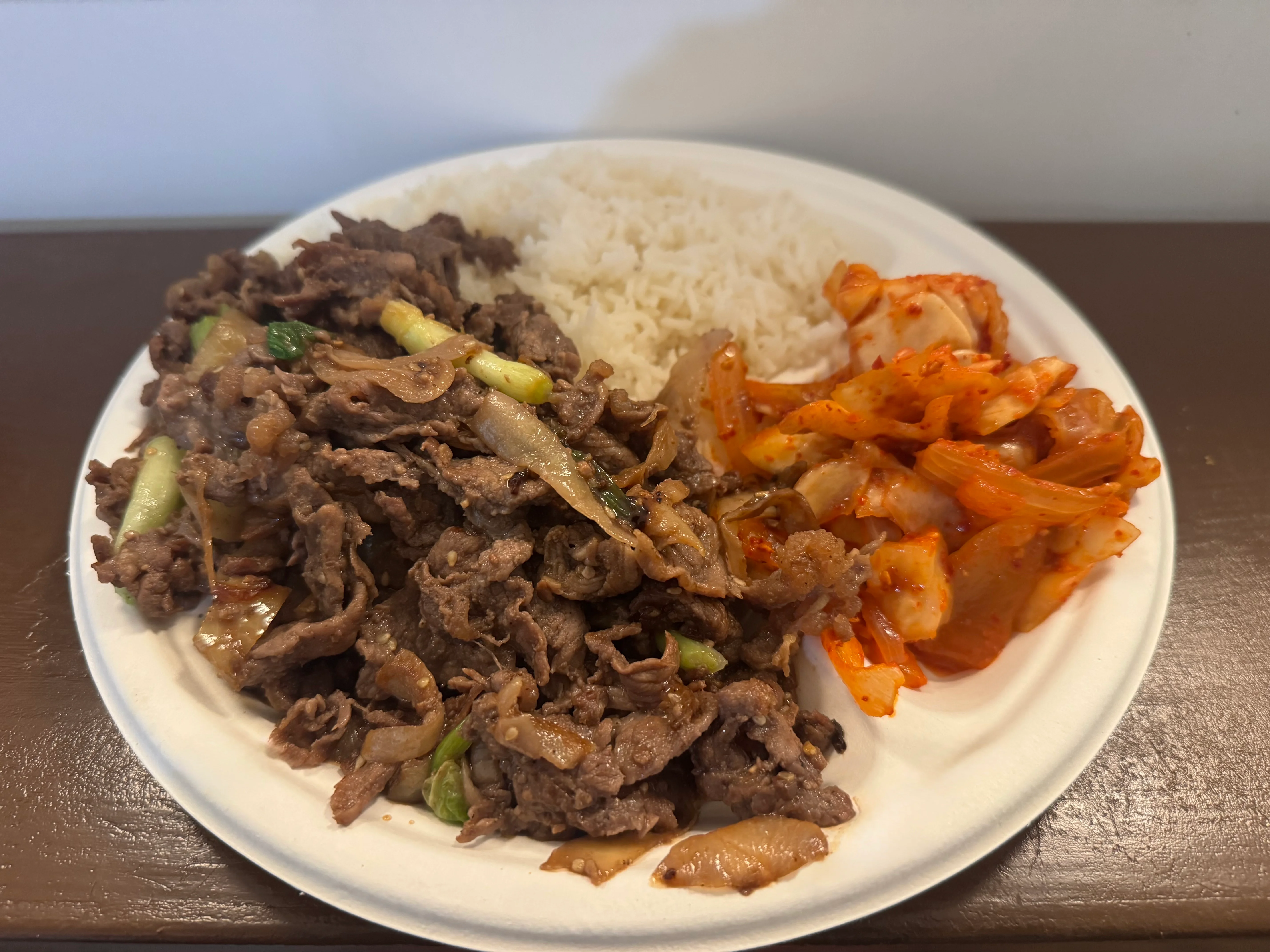 Korean bulgogi served with rice and kimchi