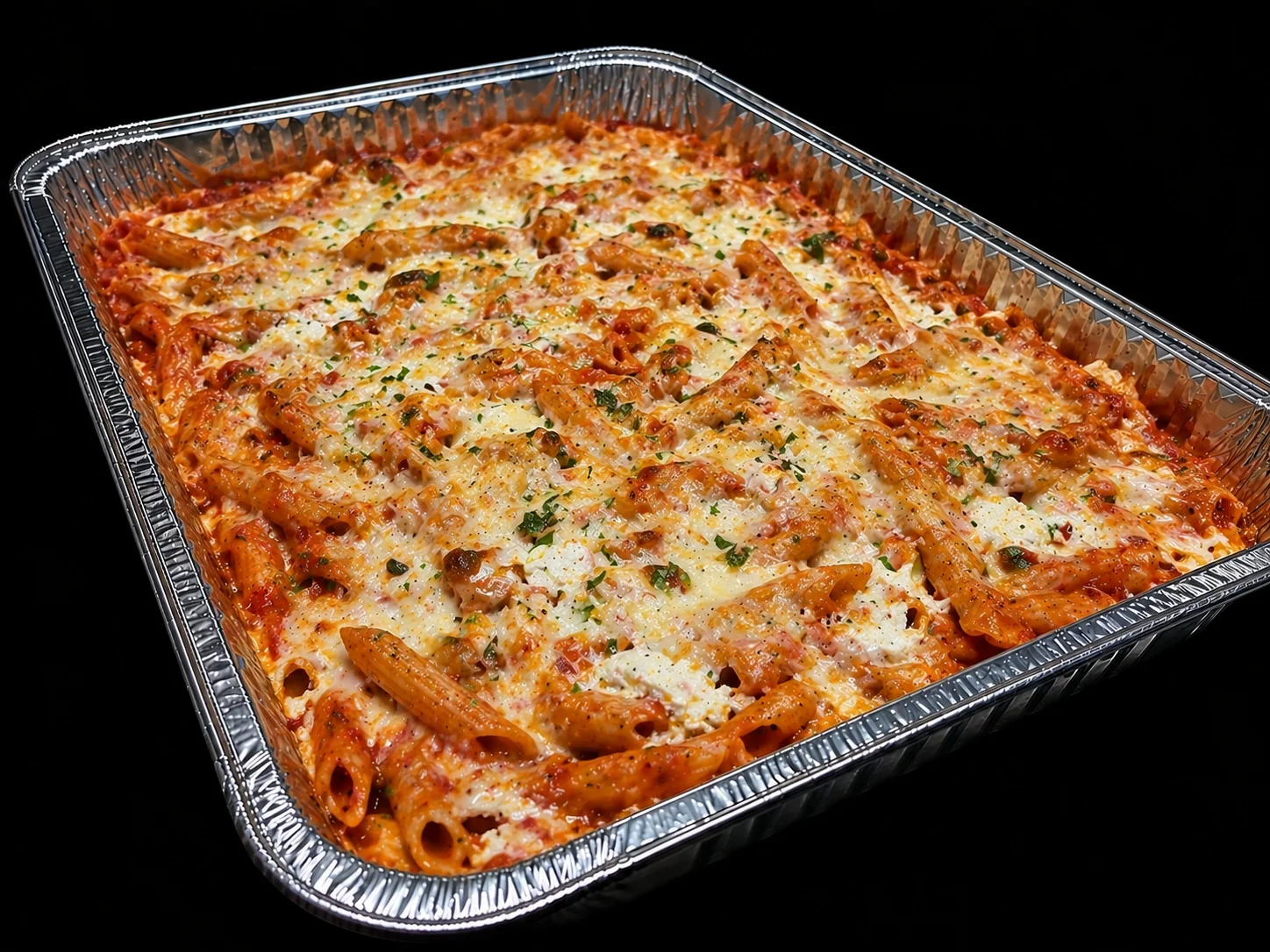 Baked ziti with melted cheese and marinara sauce