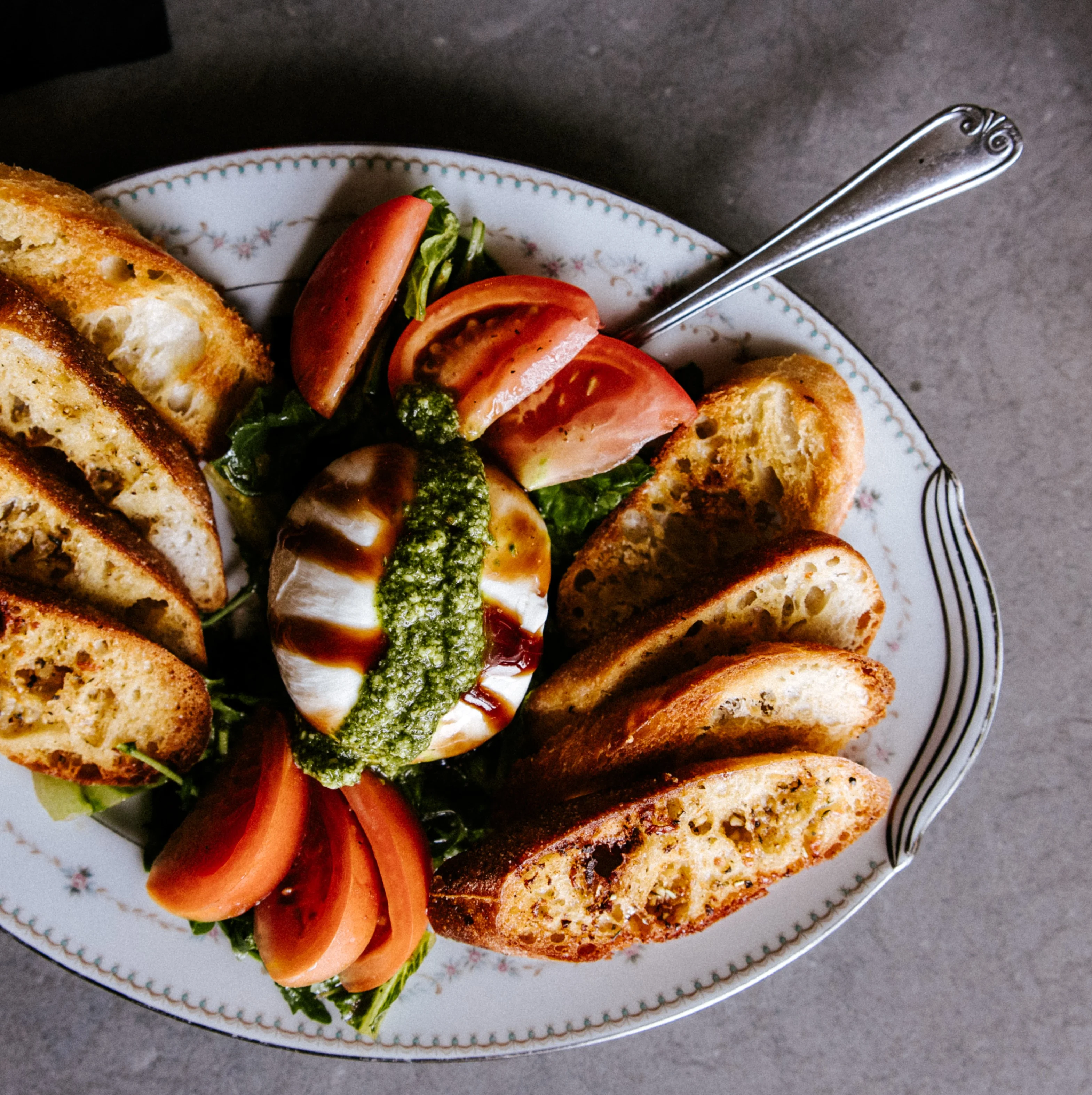 Mediterranean grilled halloumi platter with toasted bread and tomato salad