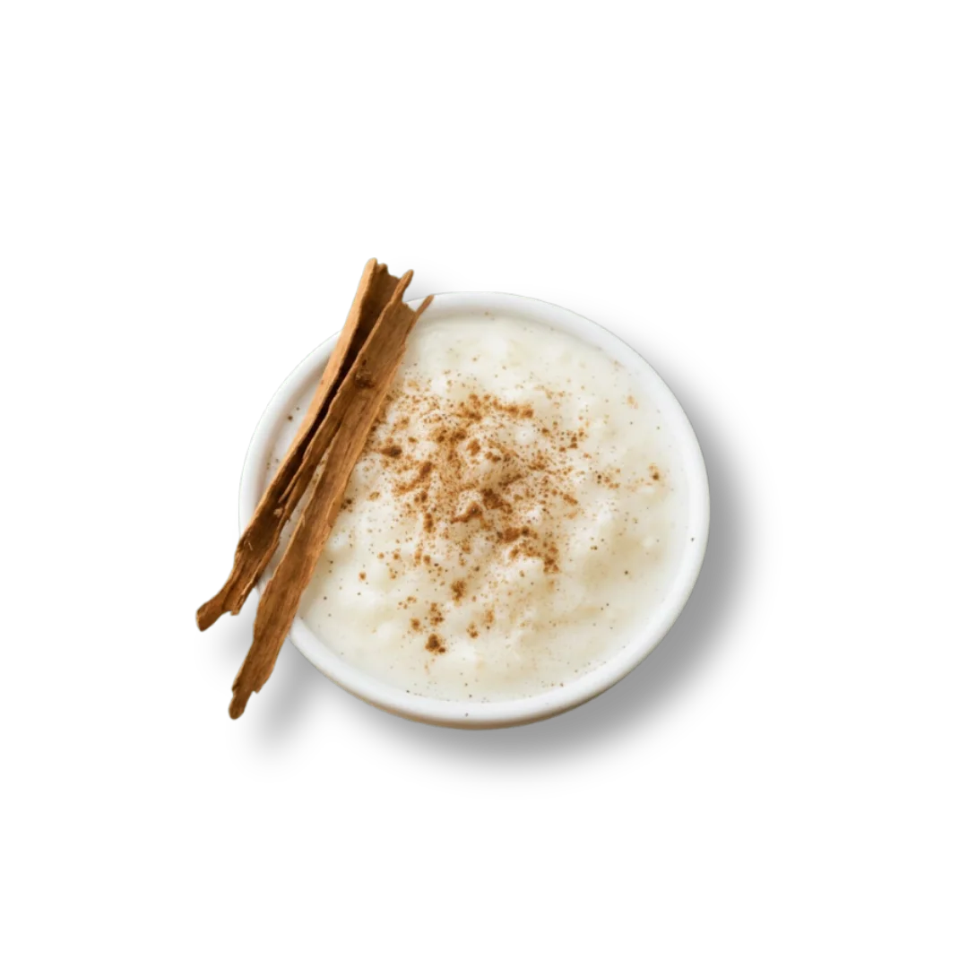 Creamy Indian kheer topped with cinnamon sticks and spices