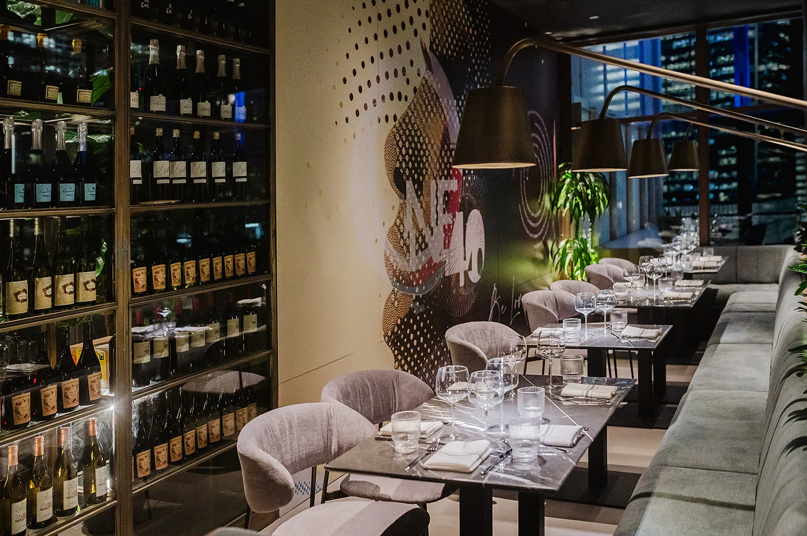 Elegant restaurant interior with wine display and modern decor
