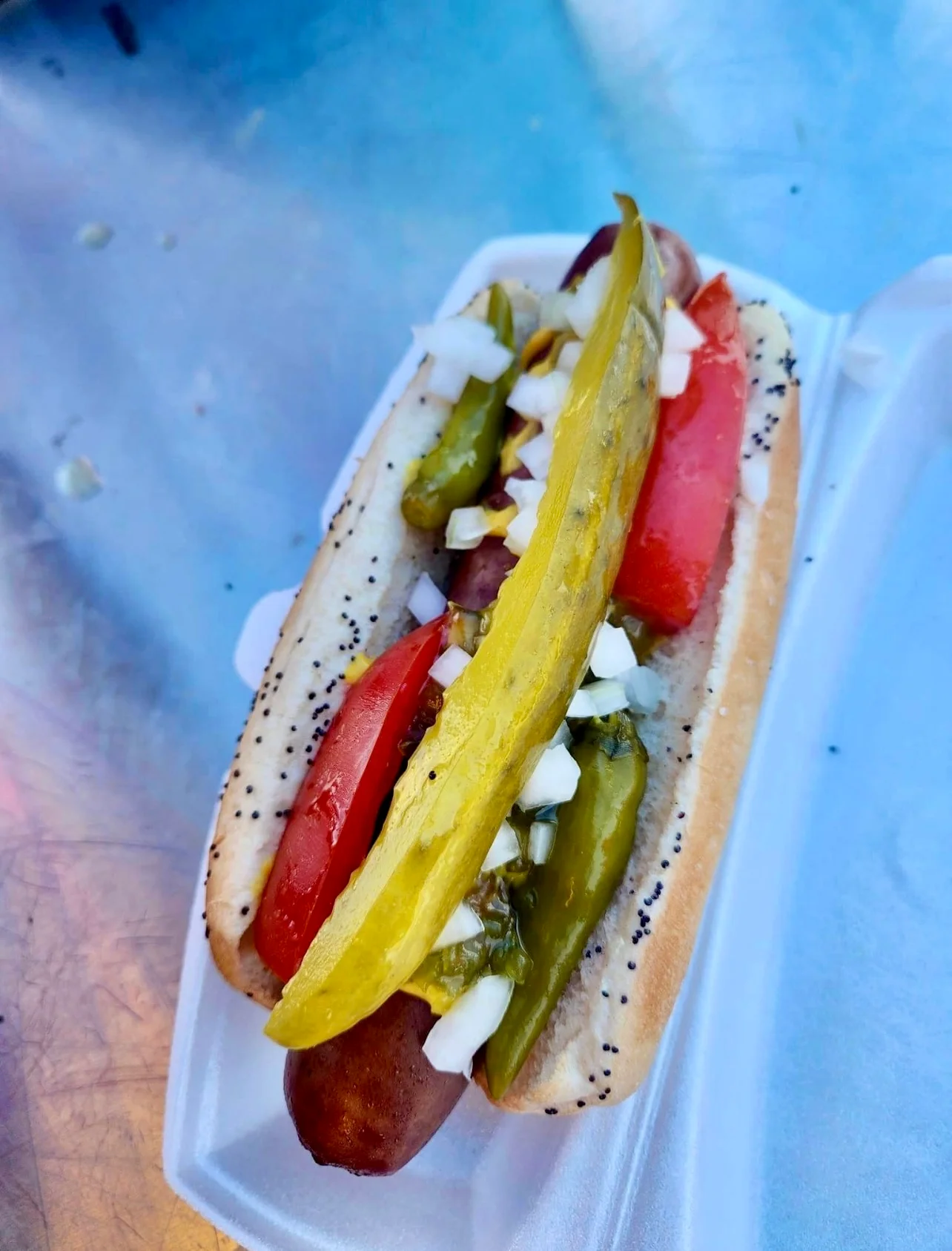 Chicago-style hot dog with vibrant toppings