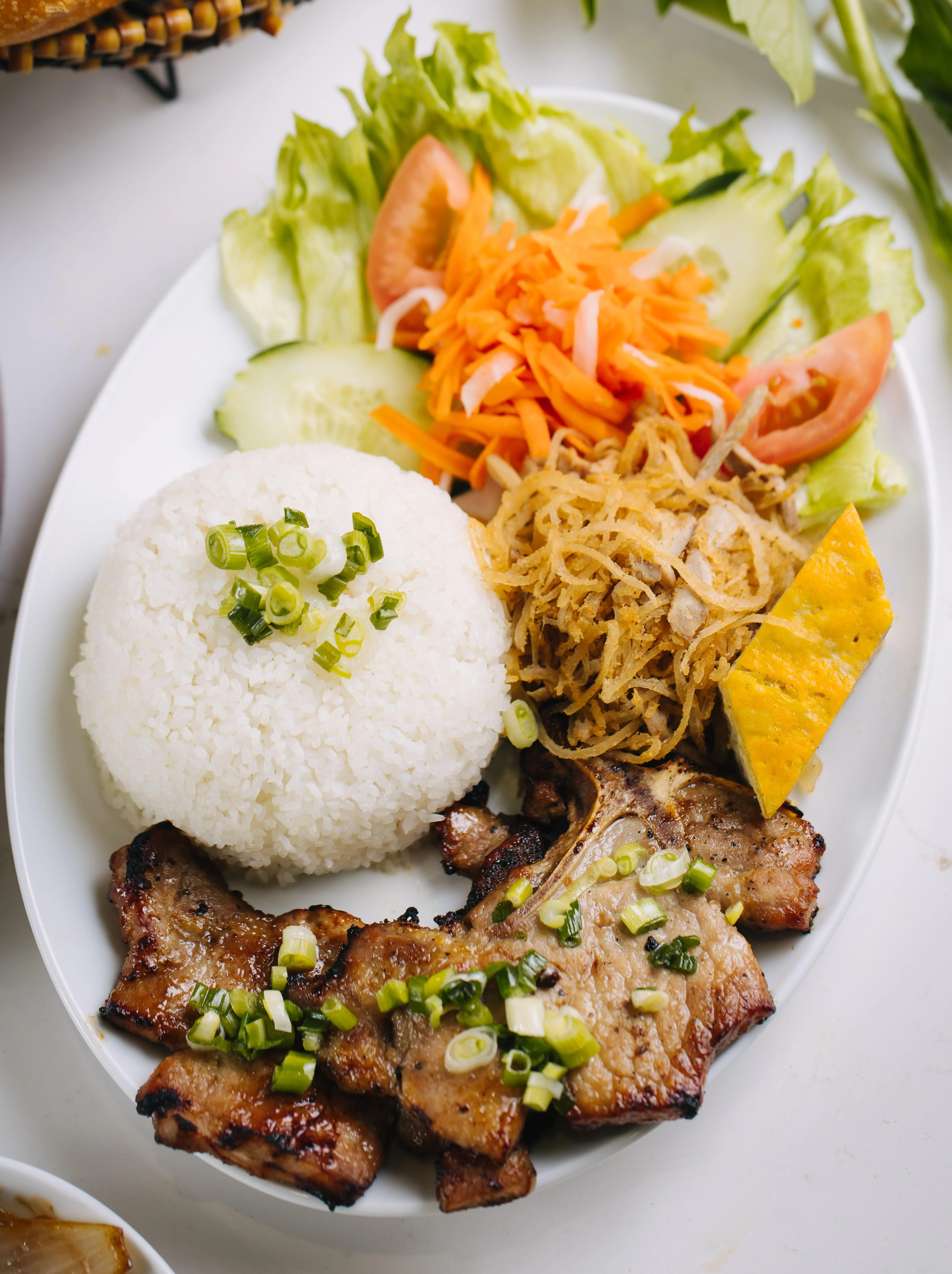27. Rice Combination with Grilled Pork Chop/Cơm Tấm Sườn Bì Chả