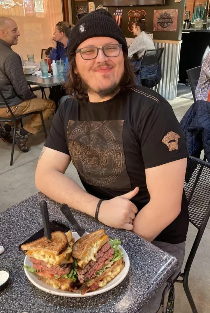 Giant American cheeseburger with fries served in a casual restaurant