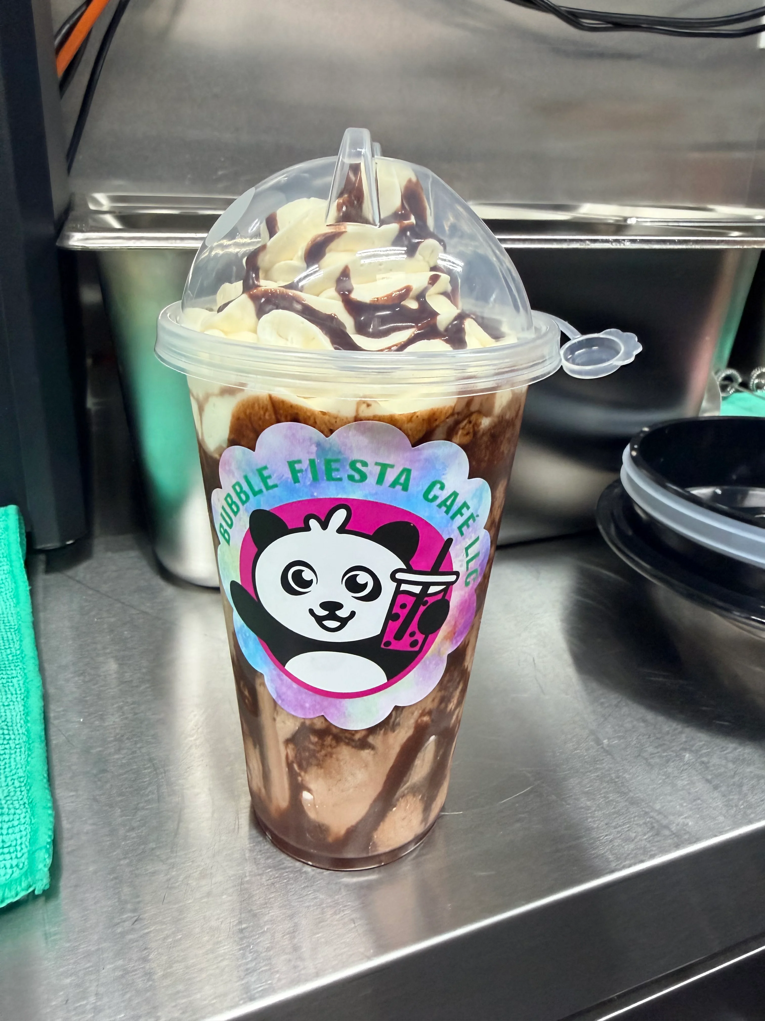 Delicious chocolate milkshake topped with whipped cream and chocolate drizzle