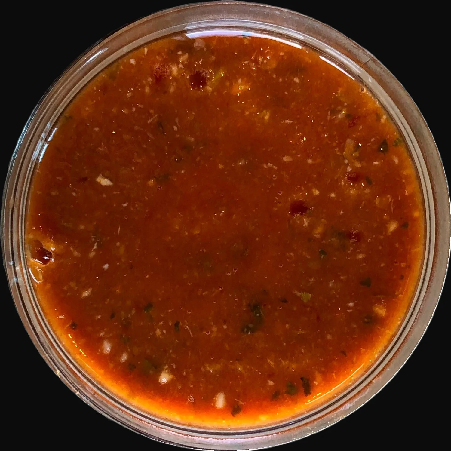 Spicy Mexican salsa in a clear container