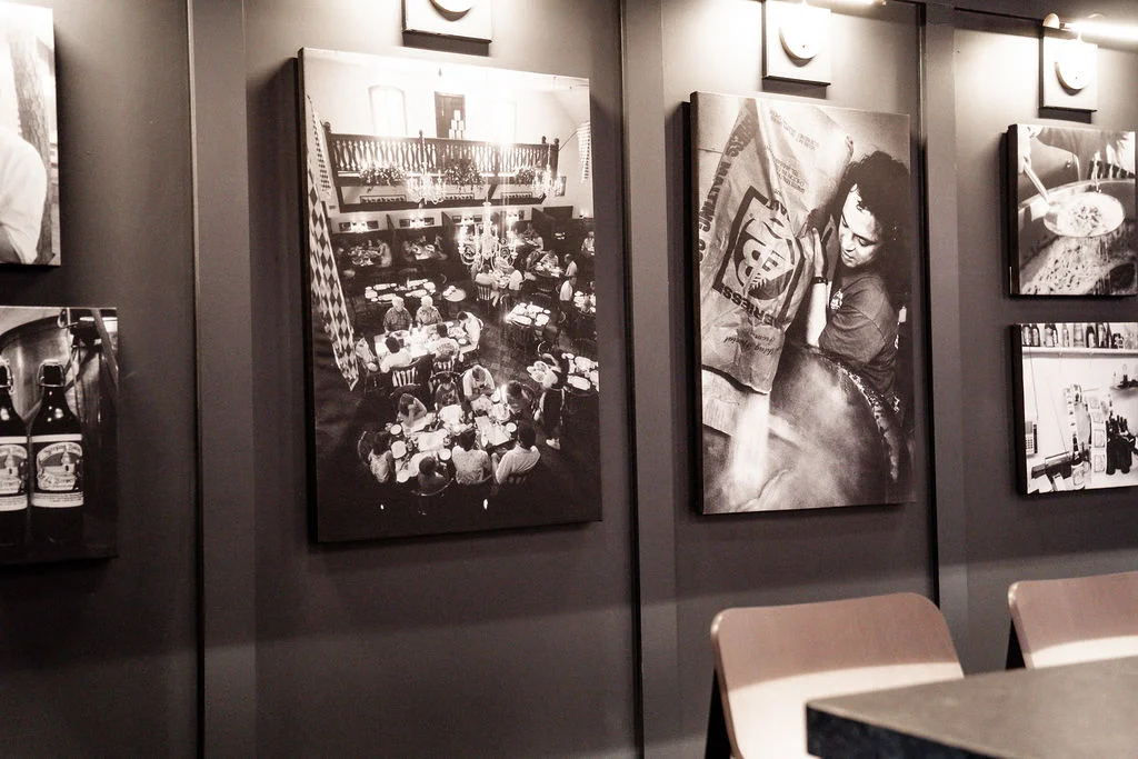 Artistic black and white restaurant interior with historical photos