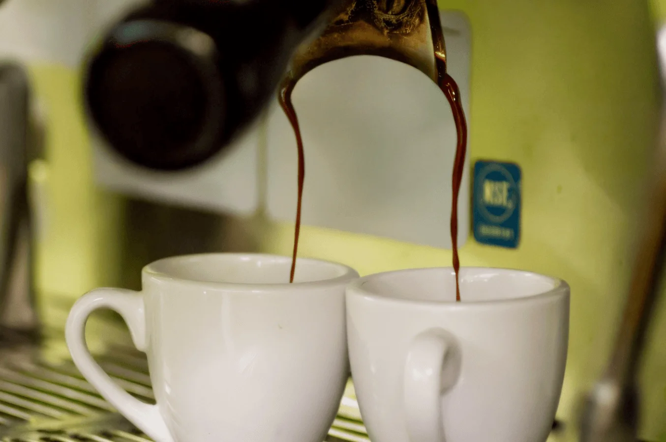 A cup of coffee, fruit, and a delectable breakfast food