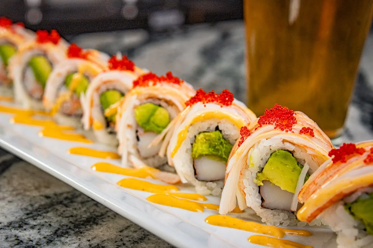 Japanese sushi rolls with avocado and spicy mayo