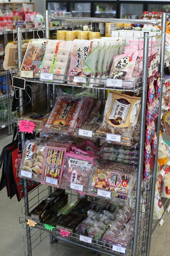 Japanese snack shelf with assorted treats and sweets