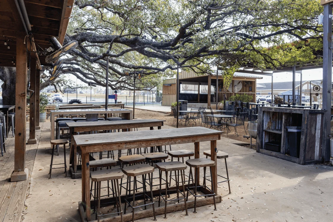 Delicious gourmet burger with fresh toppings on a wooden table