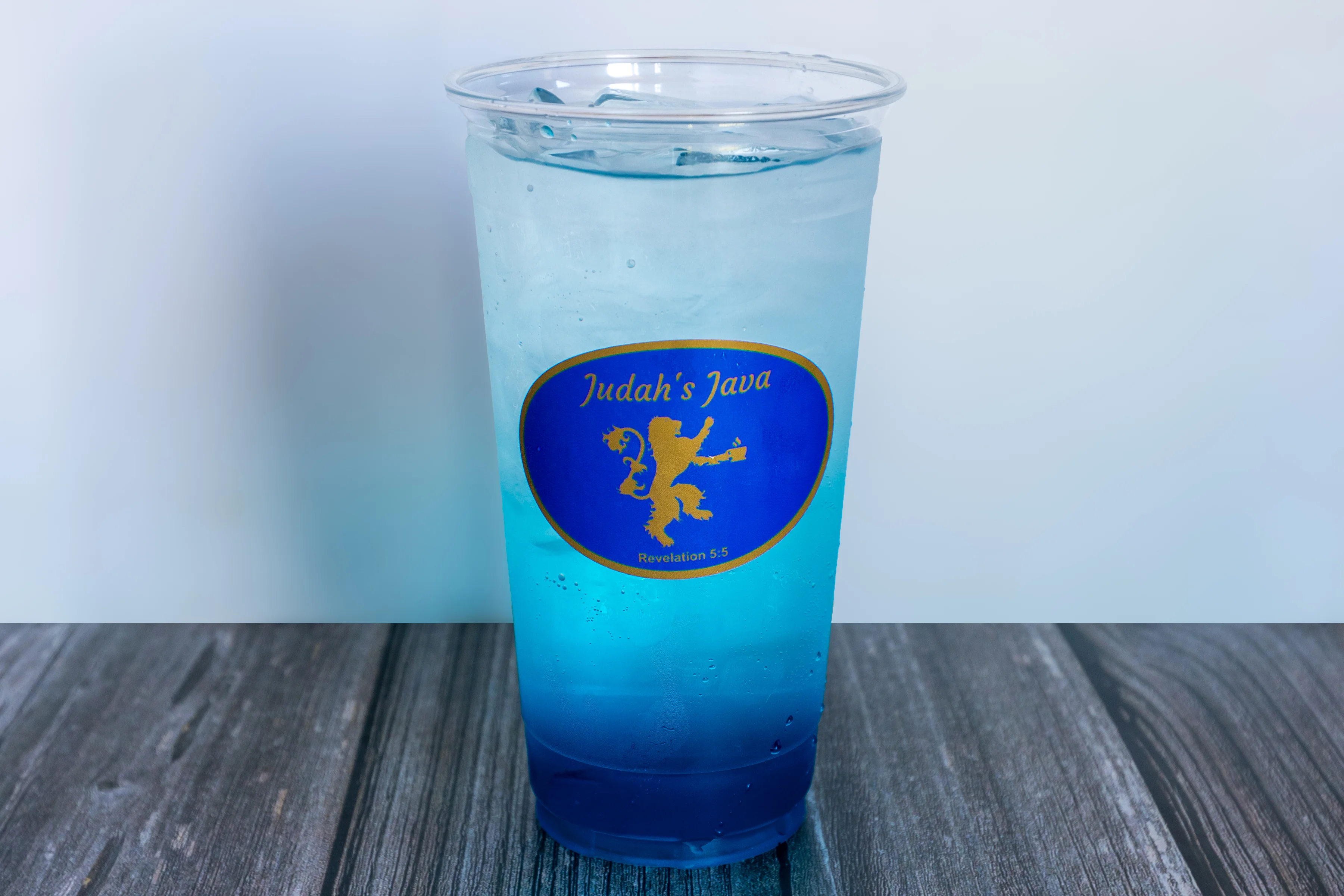 Refreshing cherry soda in a clear cup with ice
