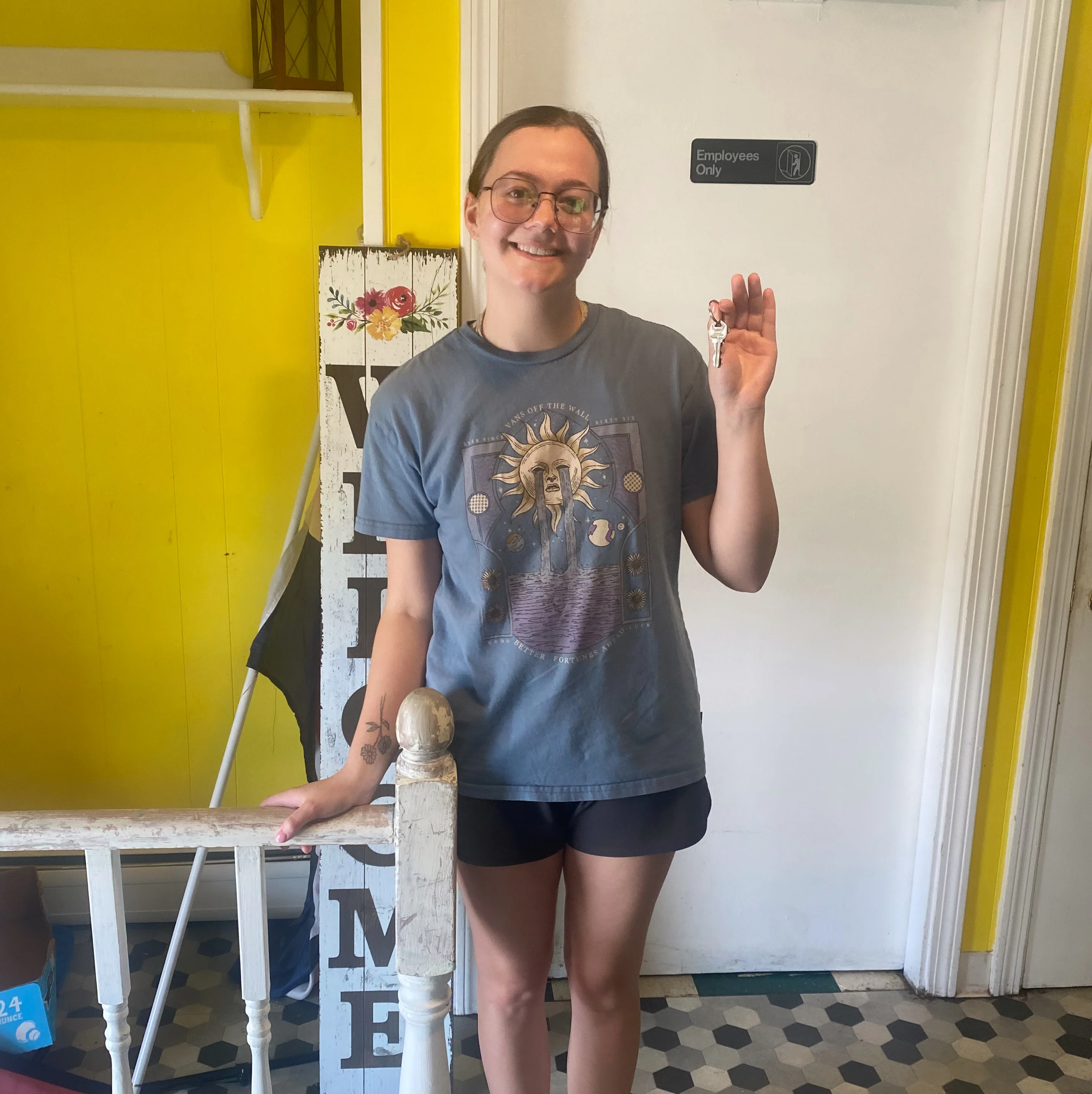 Person holding keys in a bright restaurant entryway