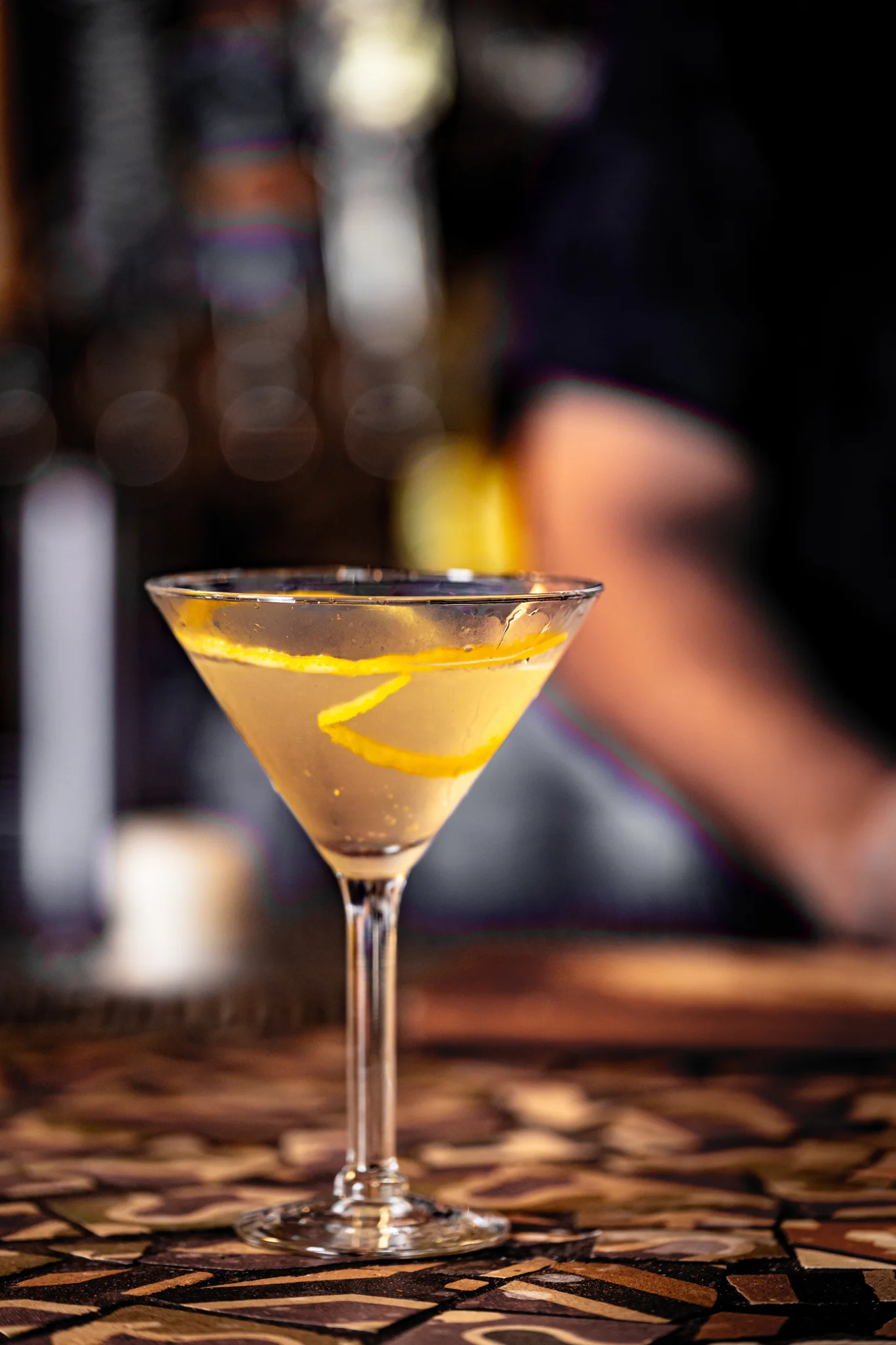 Classic cocktail with lemon twist served in a martini glass