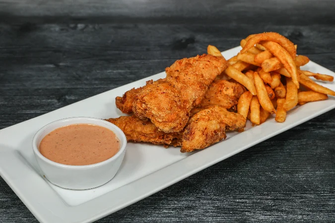 Delicious tender combo meal featuring crispy chicken and sides.