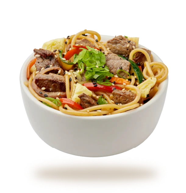 Savory beef chow mein in a white bowl with colorful vegetables