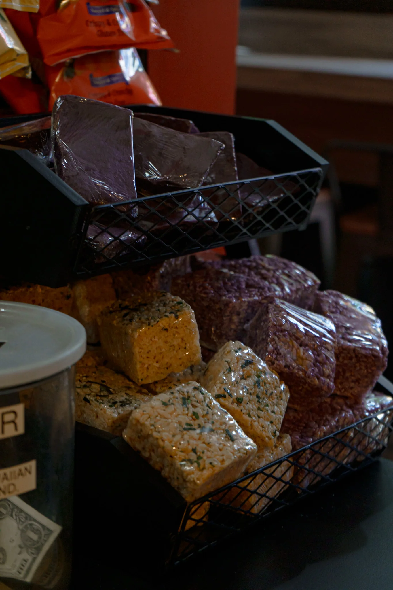 Assorted colorful rice cakes displayed in a cafe