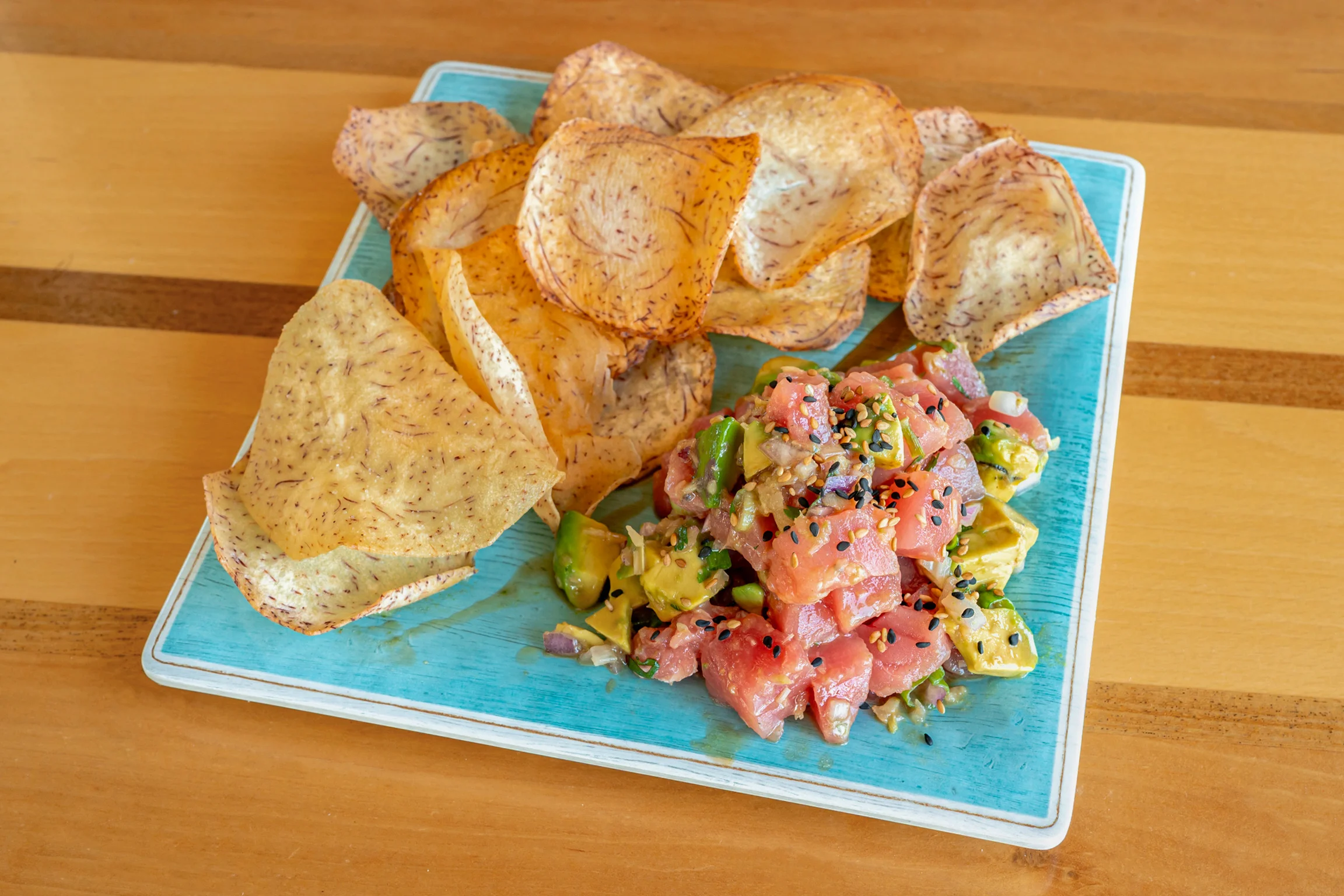 Hawaiian poke bowl with taro chips