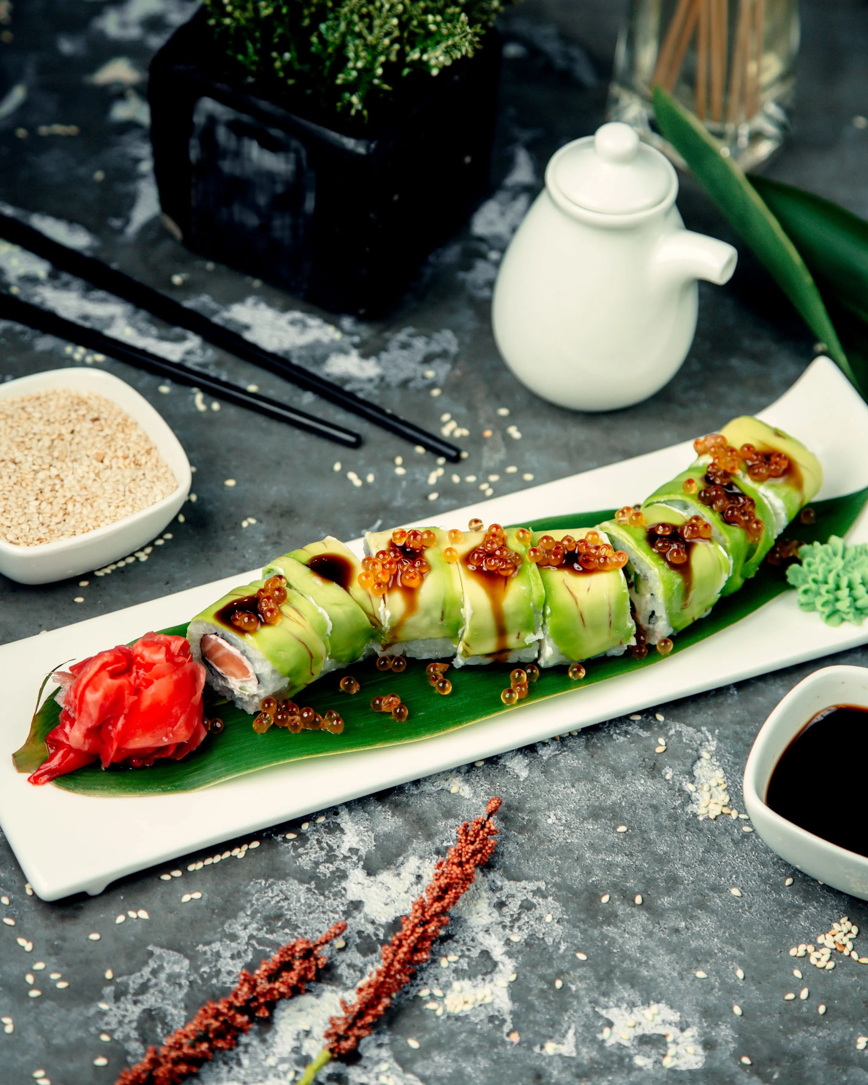 Japanese sushi roll with avocado and fish roe