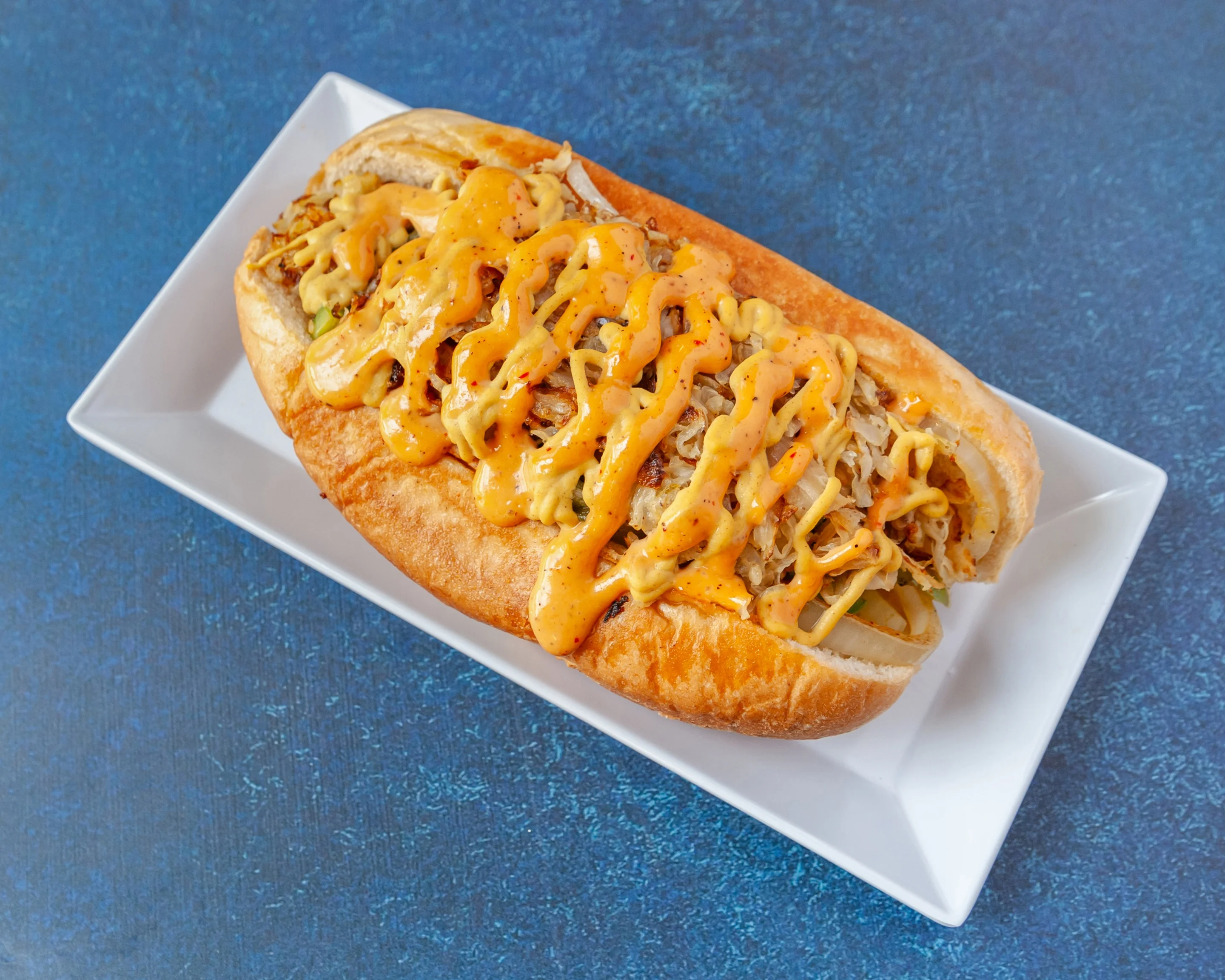 Loaded Korean-style hot dog with spicy sauce