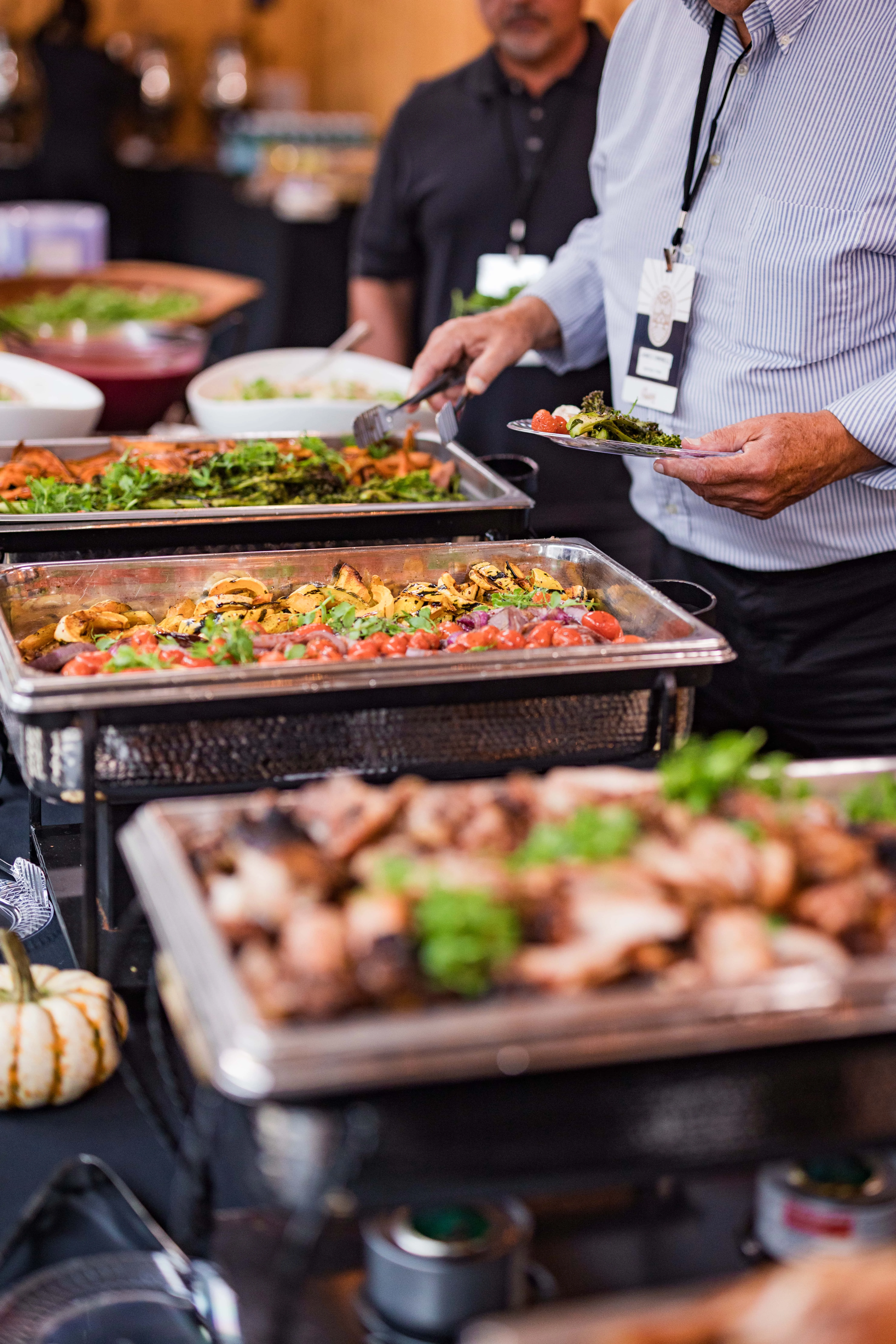 Buffet spread featuring grilled vegetables and meats