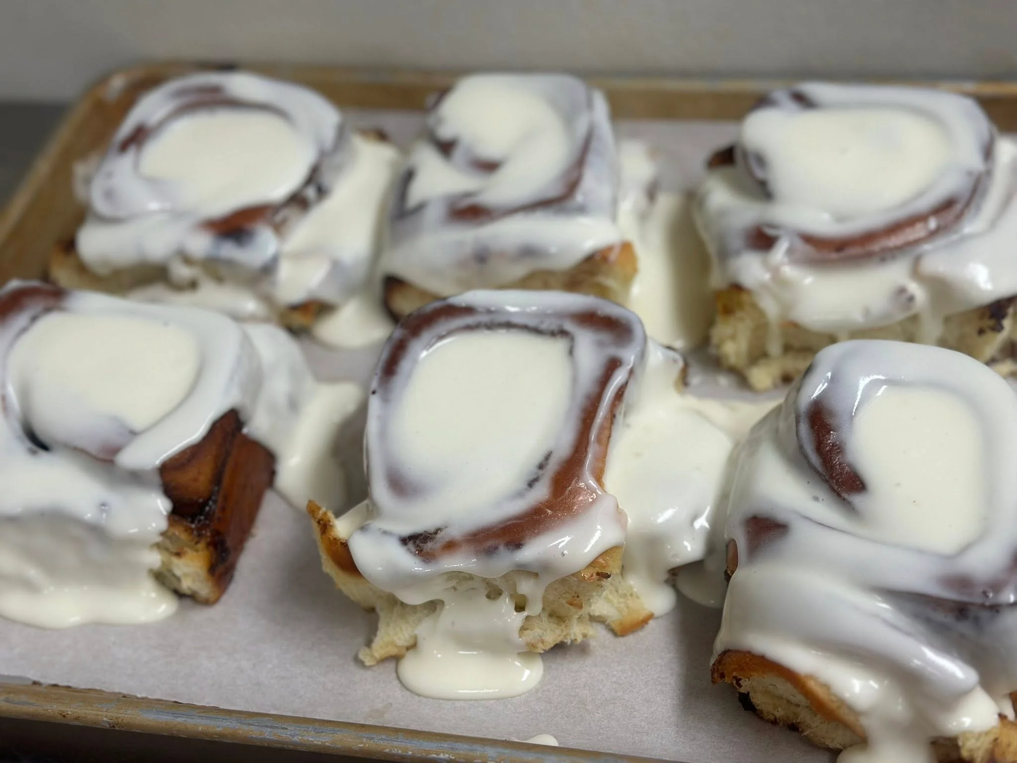 Freshly baked cinnamon rolls with cream cheese frosting