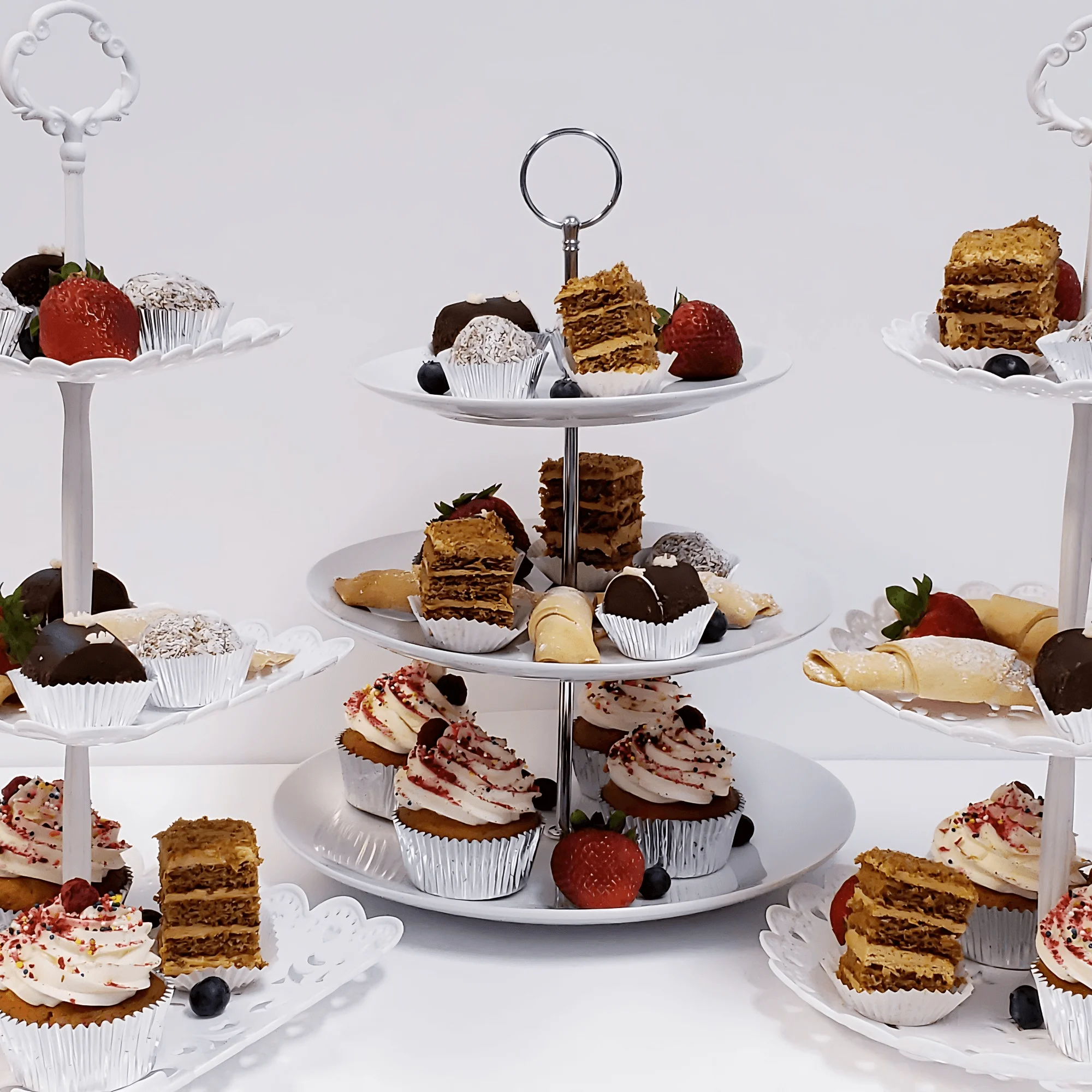 Elegant dessert platter with assorted pastries and cupcakes
