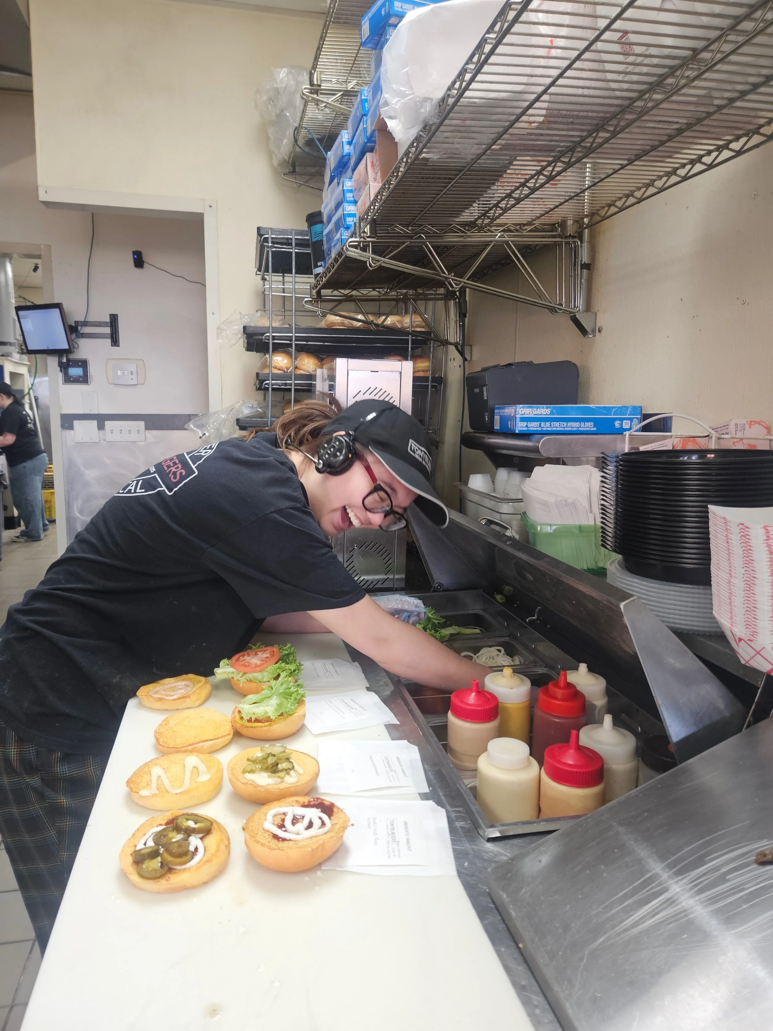 Busy kitchen staff preparing food in a restaurant setting