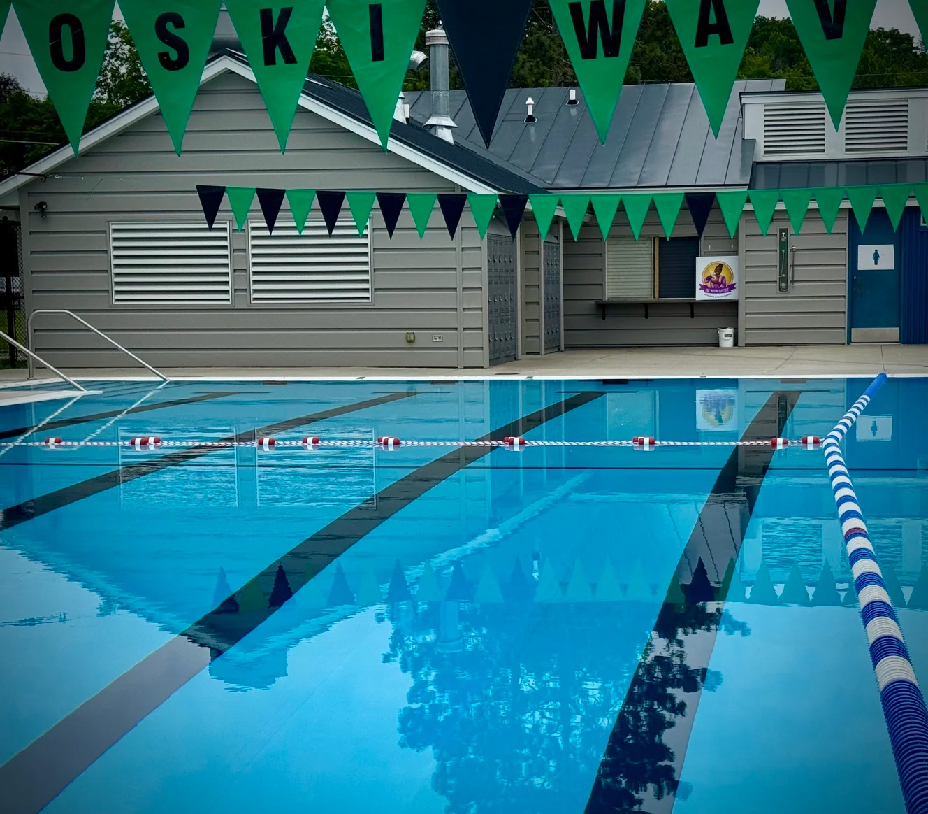 Swimming pool with vibrant flags and modern facilities
