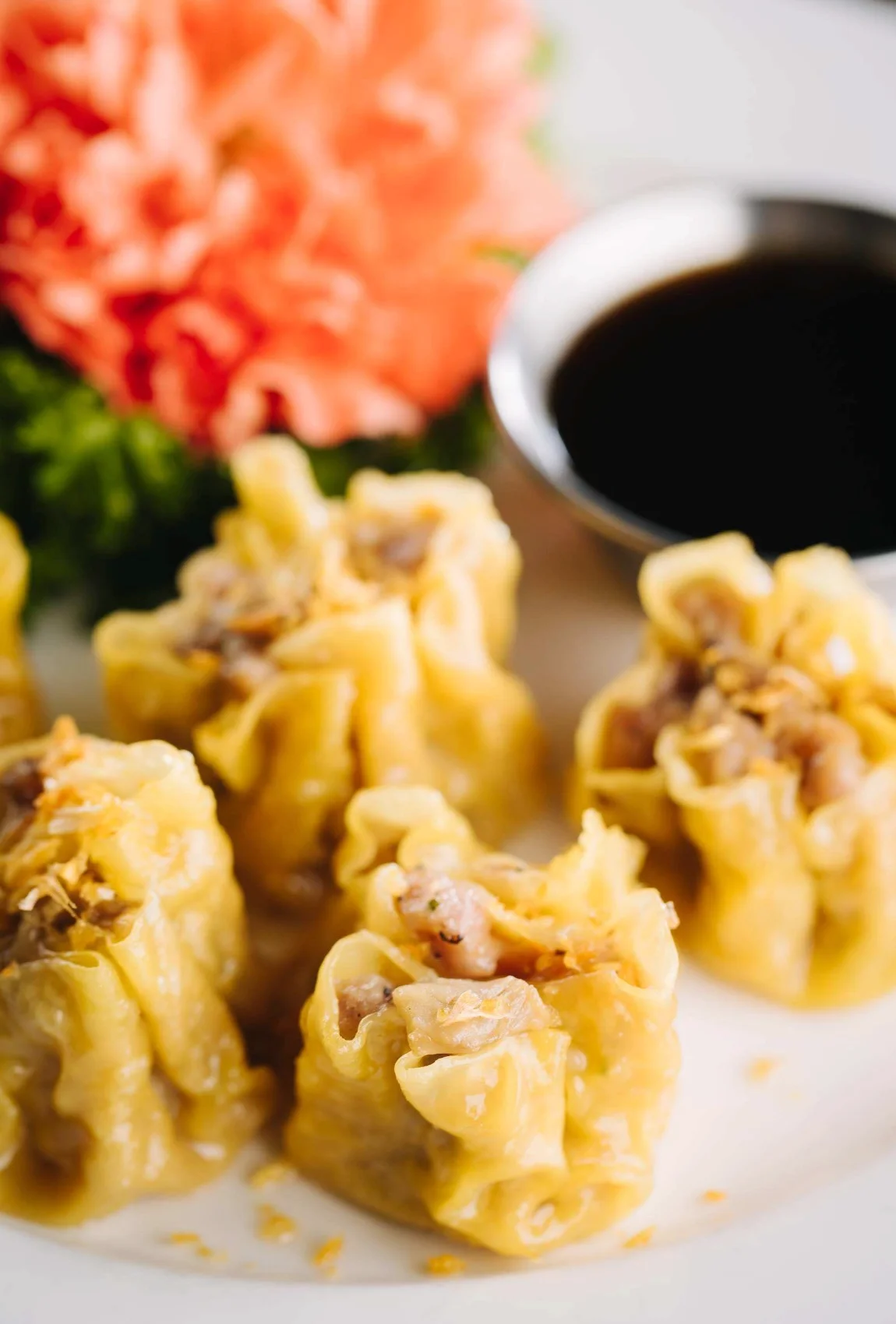 Delicious Chinese siu mai dumplings served with soy sauce