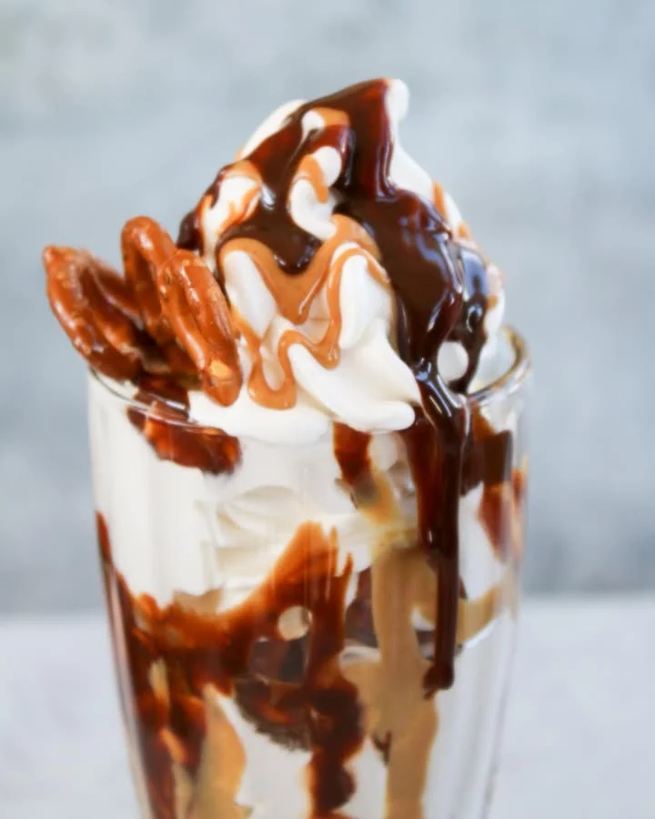 Decadent sundae with chocolate and caramel drizzle