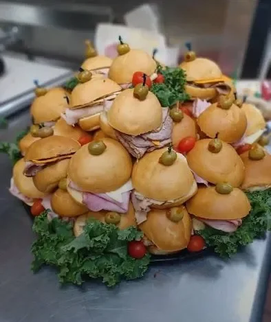 Giant Italian sub sandwich with layers of meats and fresh toppings