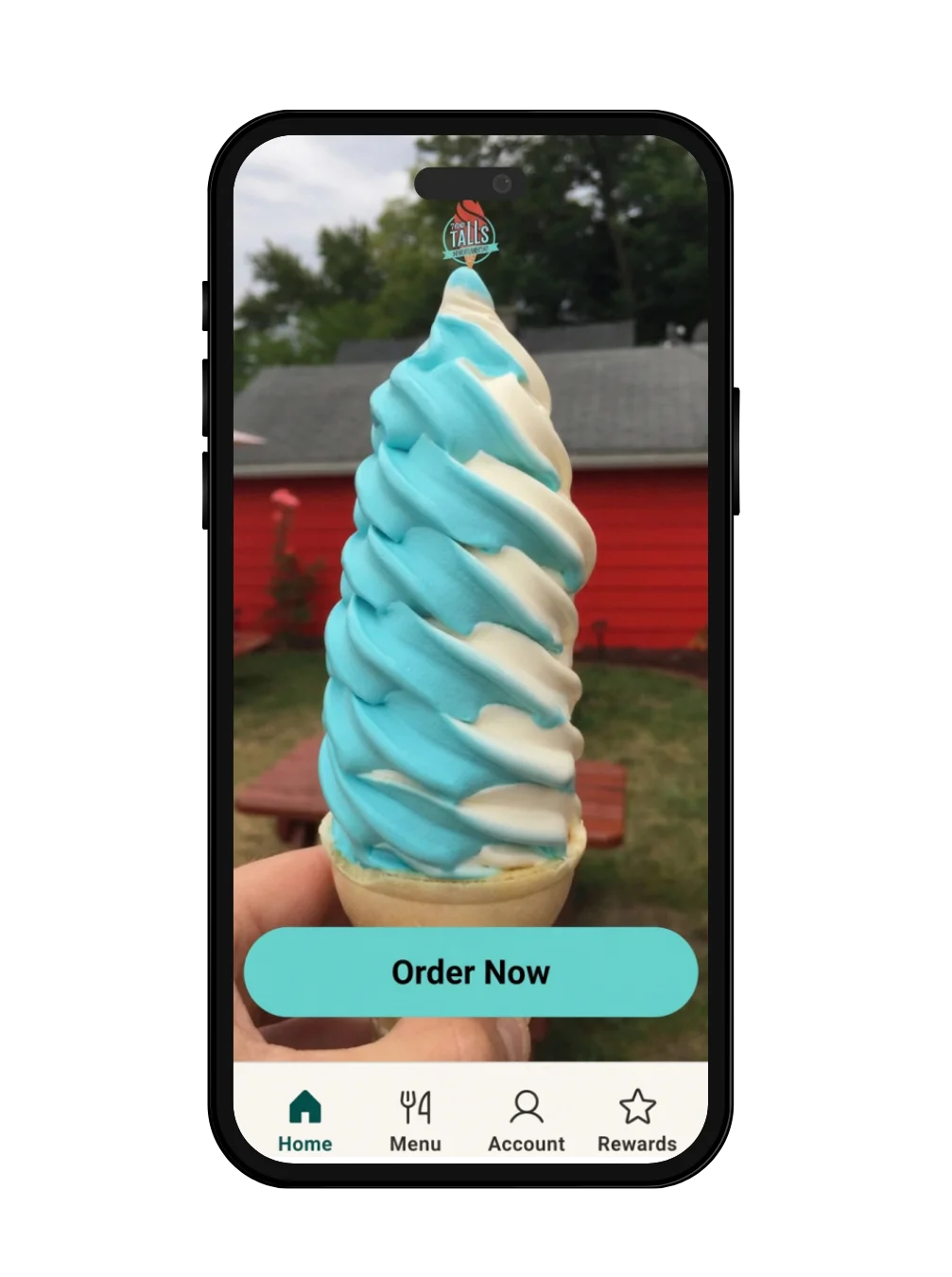 Swirled soft serve ice cream cone in vibrant blue and white