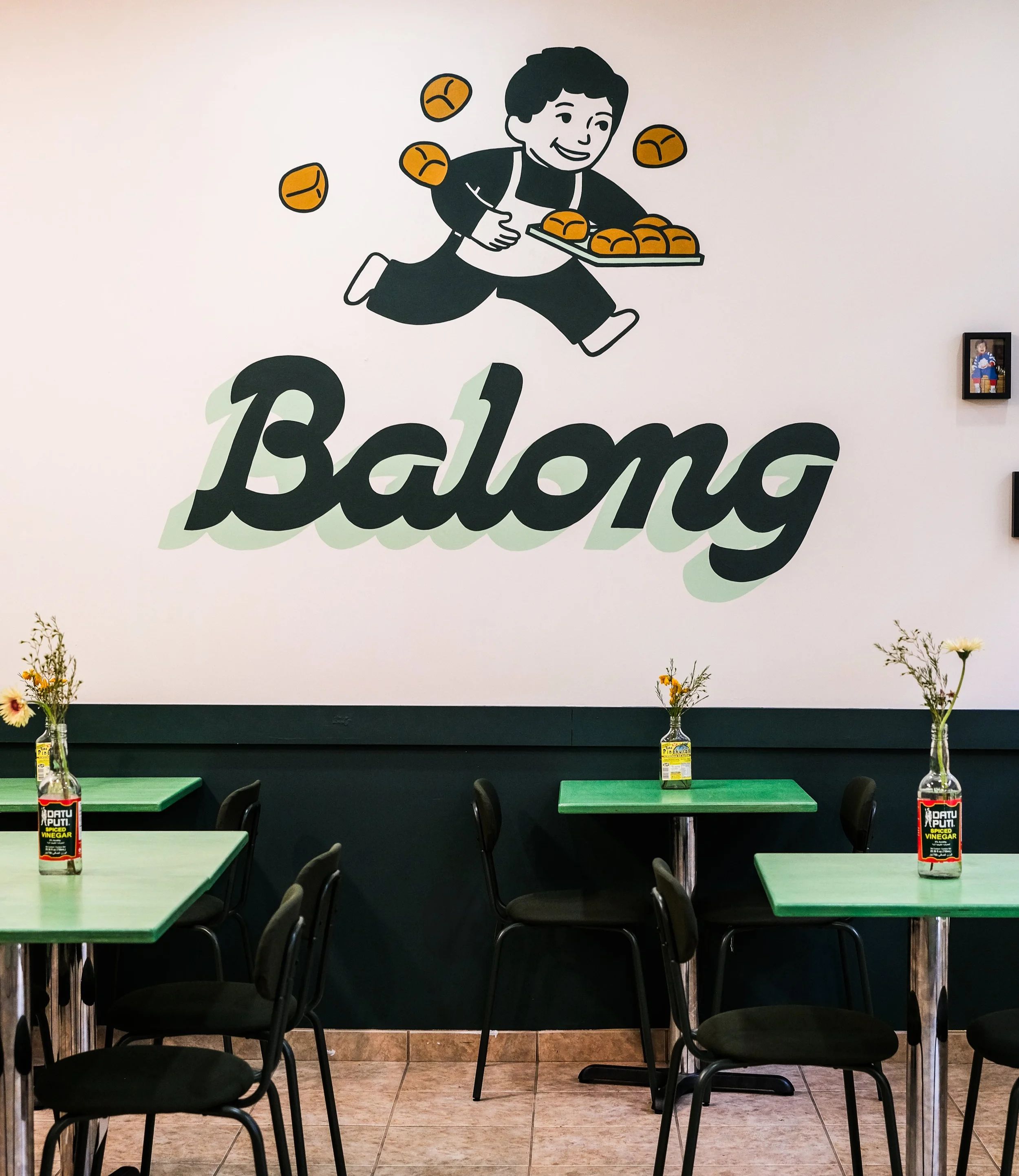 Logo of Balong featuring a cheerful character with a tray of baked goods.