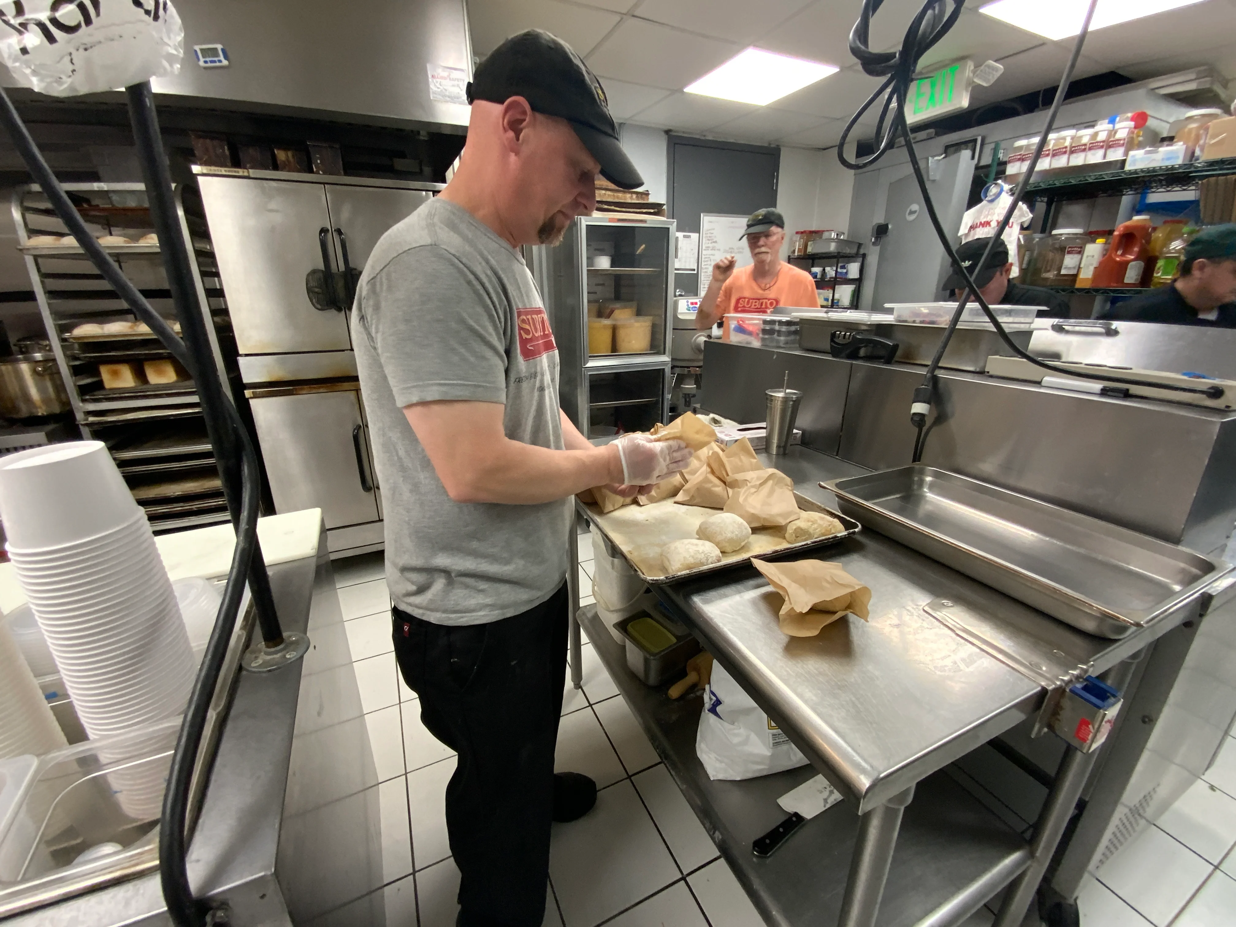 Chef Chuck places his Garda rolls into individual bags for his next catering order.