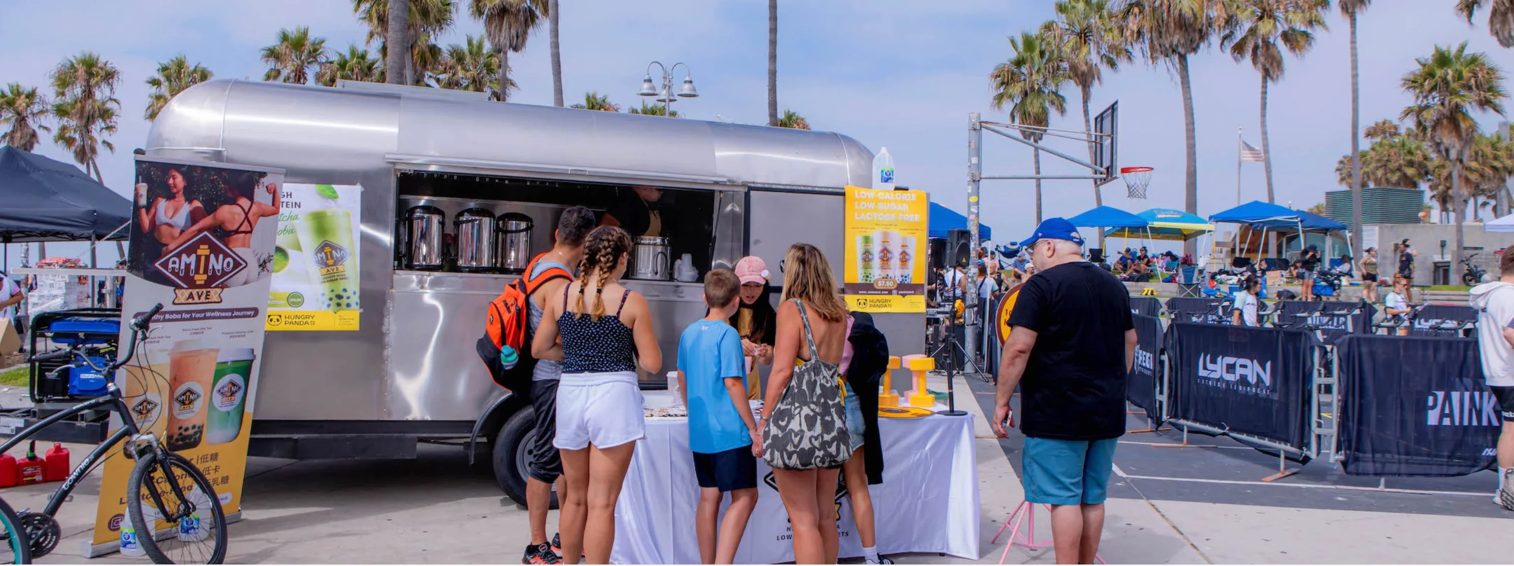 Food truck serving healthy boba drinks at a beach event