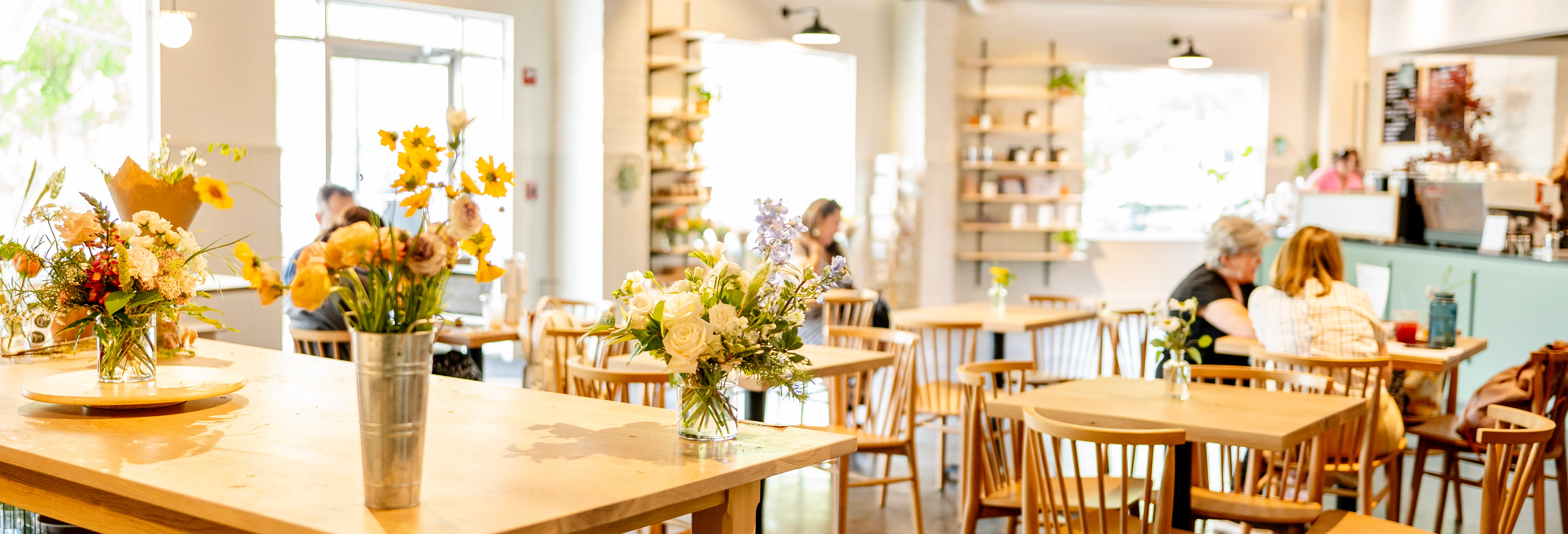 Bright and inviting restaurant interior with floral arrangements