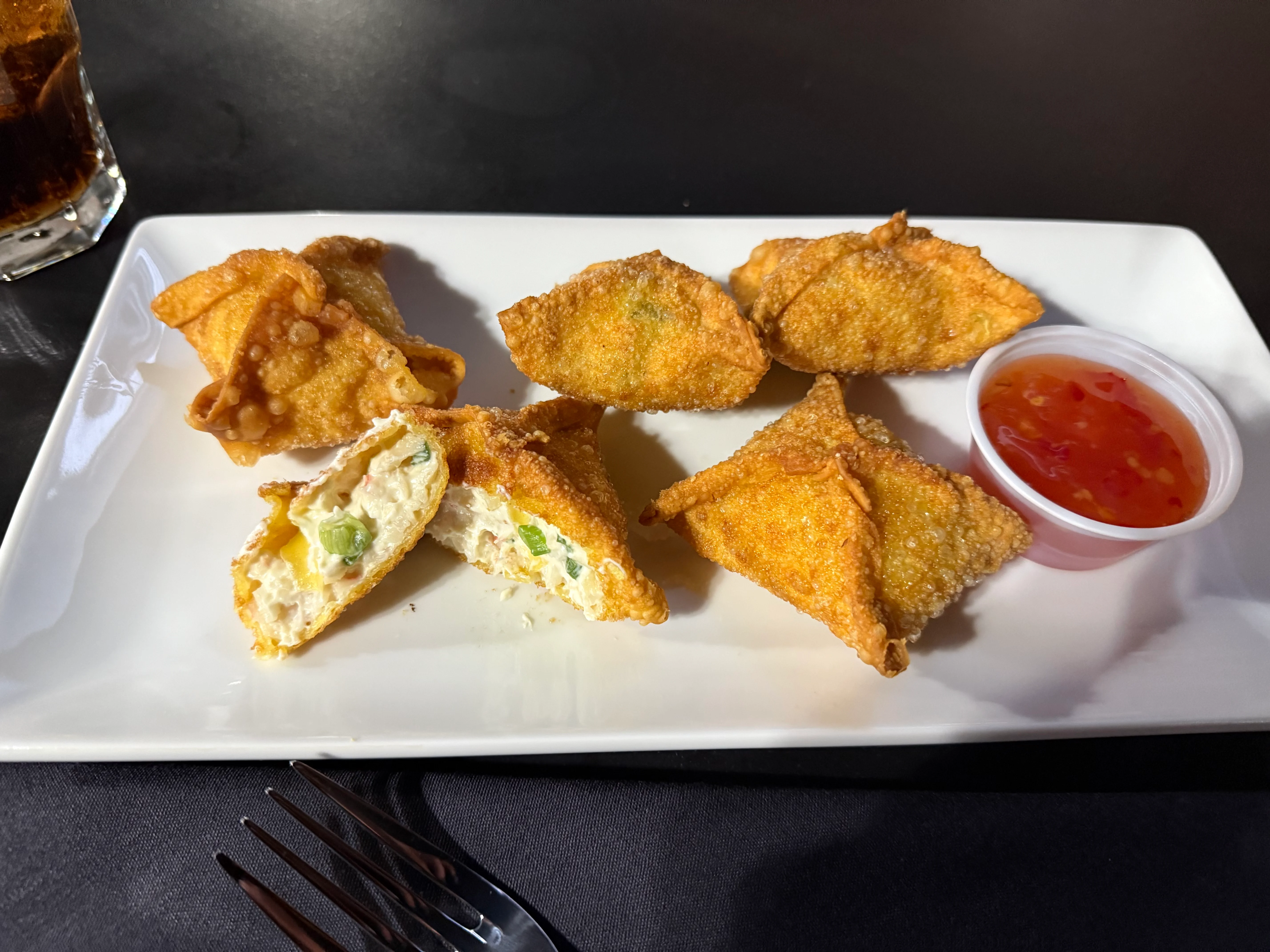 Crispy crab rangoon served with sweet chili sauce