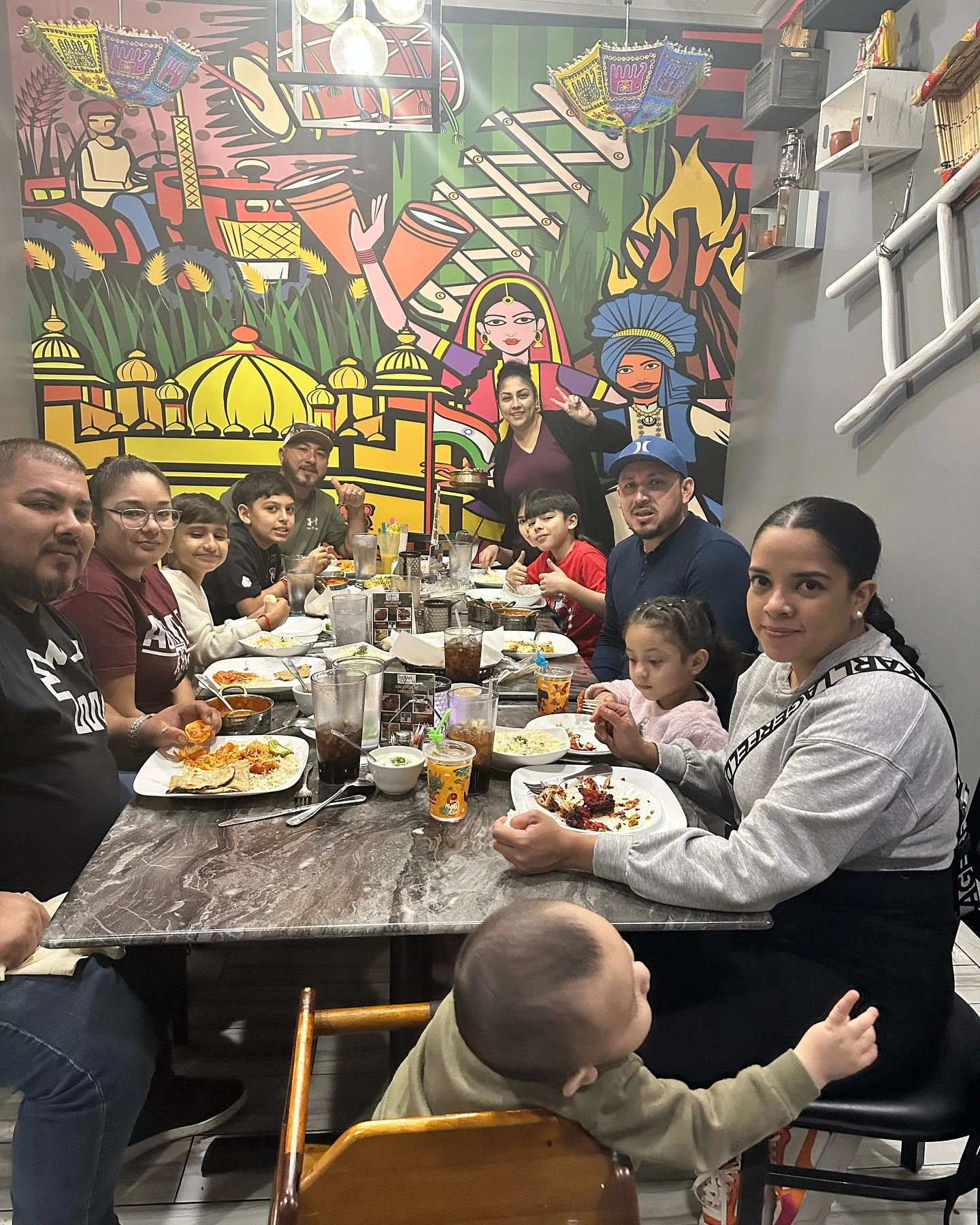 Family dining at a vibrant restaurant with traditional decor