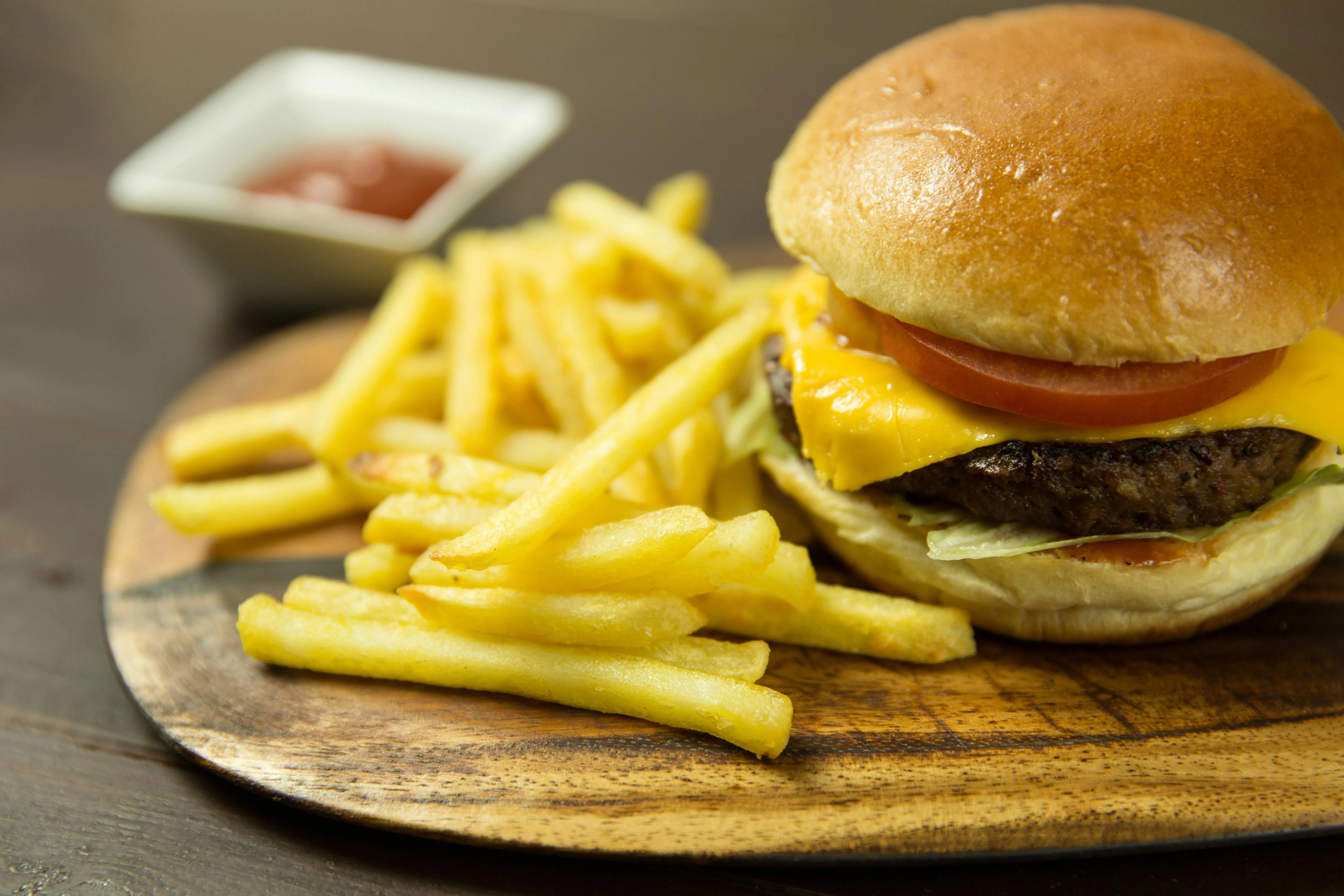 Classic American cheeseburger with fries and ketchup