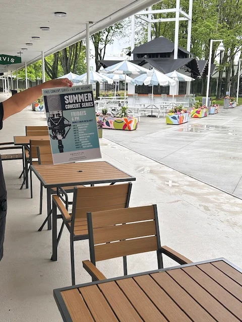 Outdoor dining area promoting summer concert series