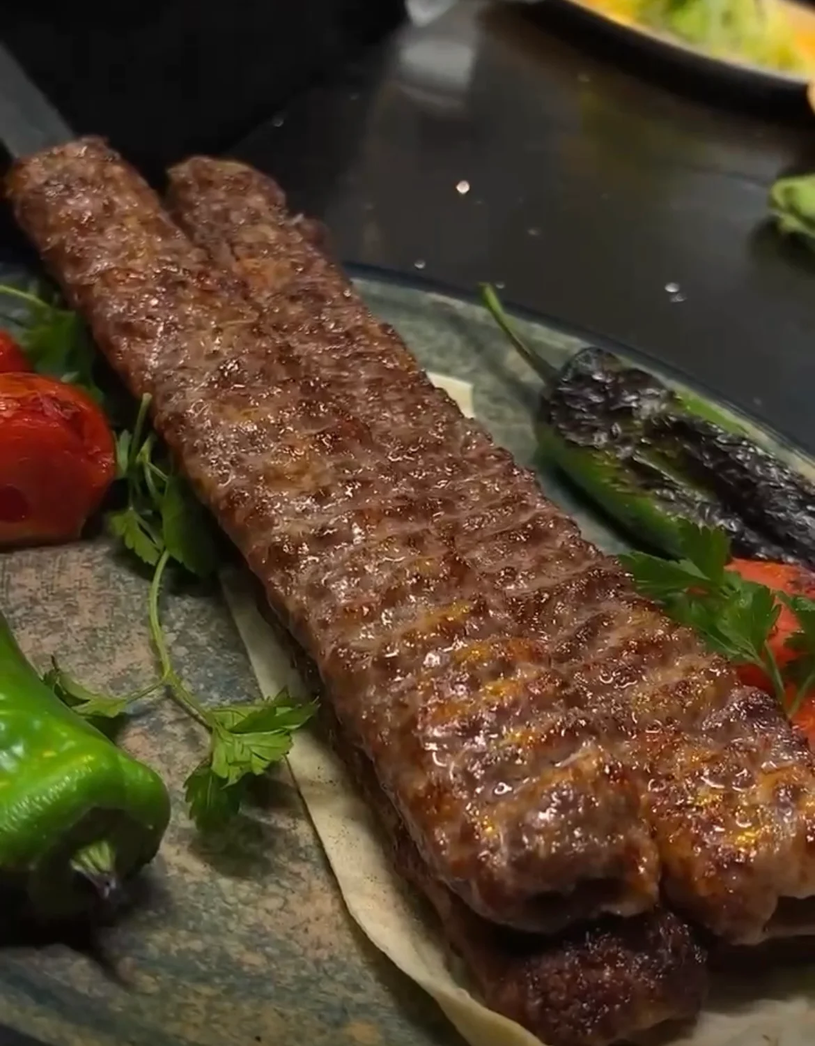 Grilled Turkish kebab served with vegetables