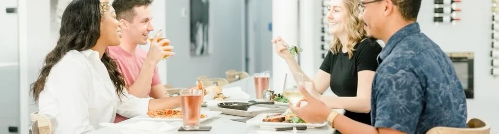 Group of friends enjoying a meal at a modern restaurant