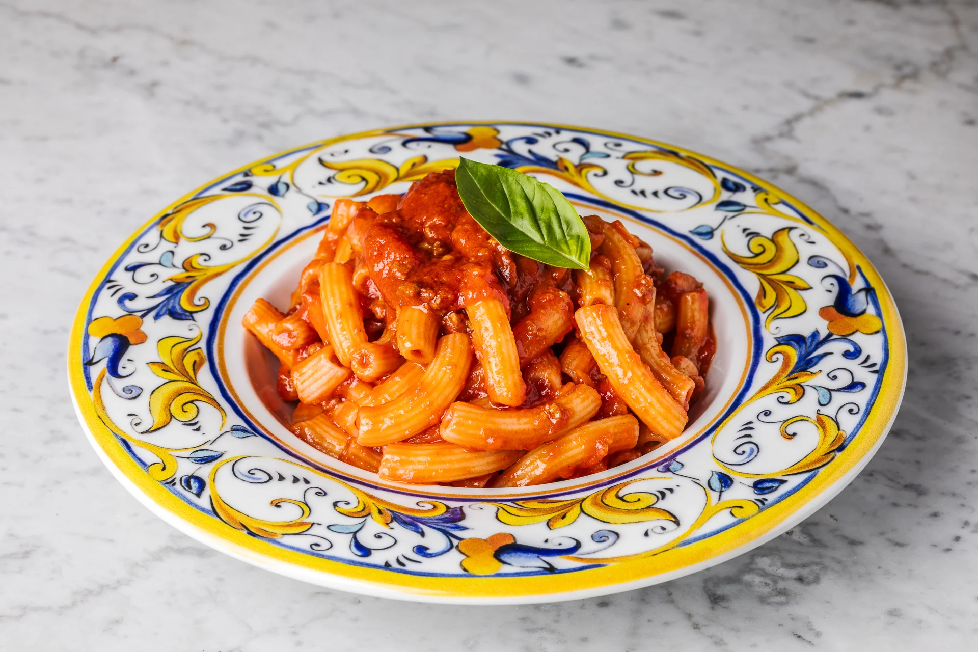 Classic Italian pasta al pomodoro with fresh basil