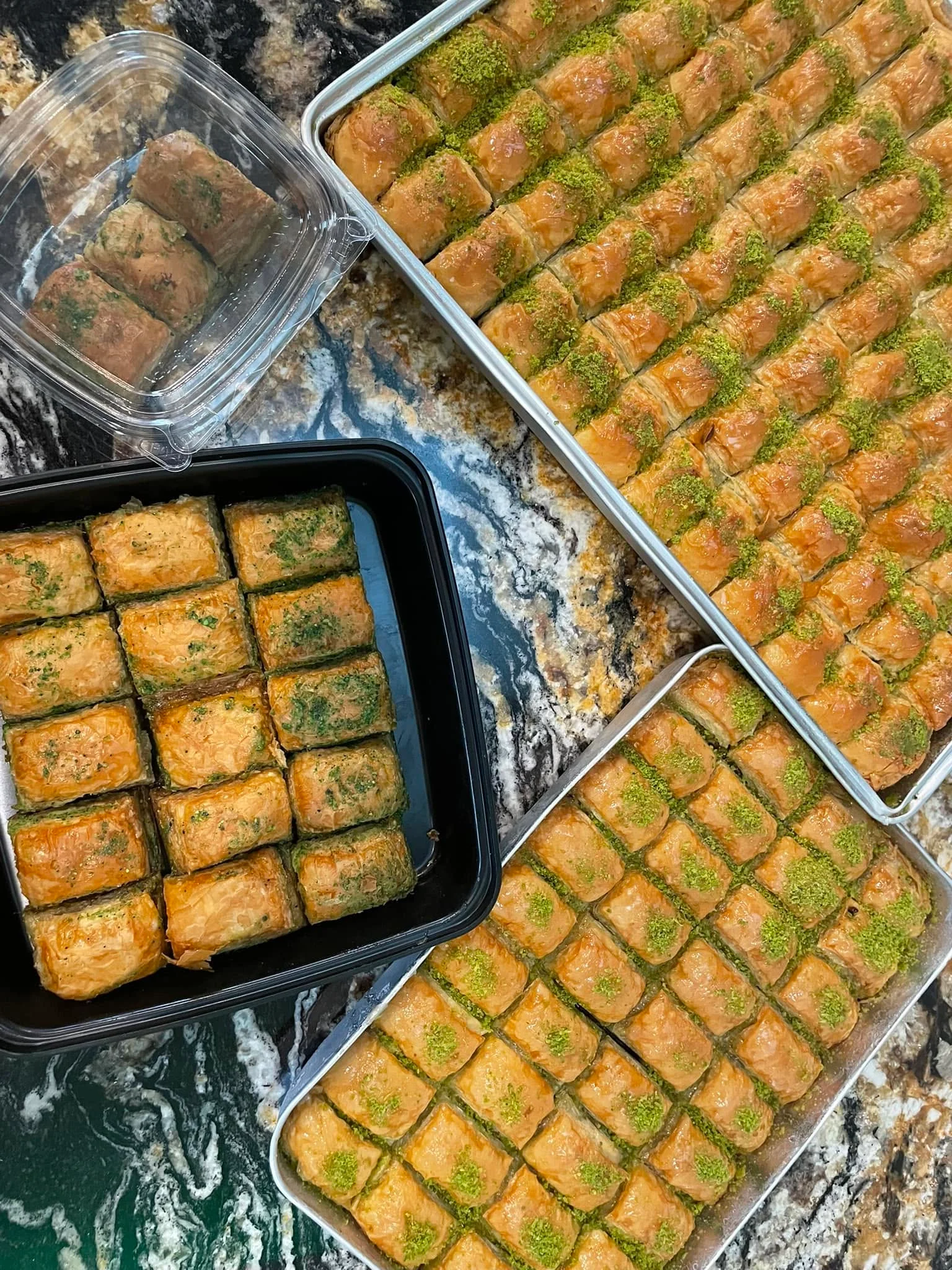 Delicious trays of Turkish baklava topped with pistachios